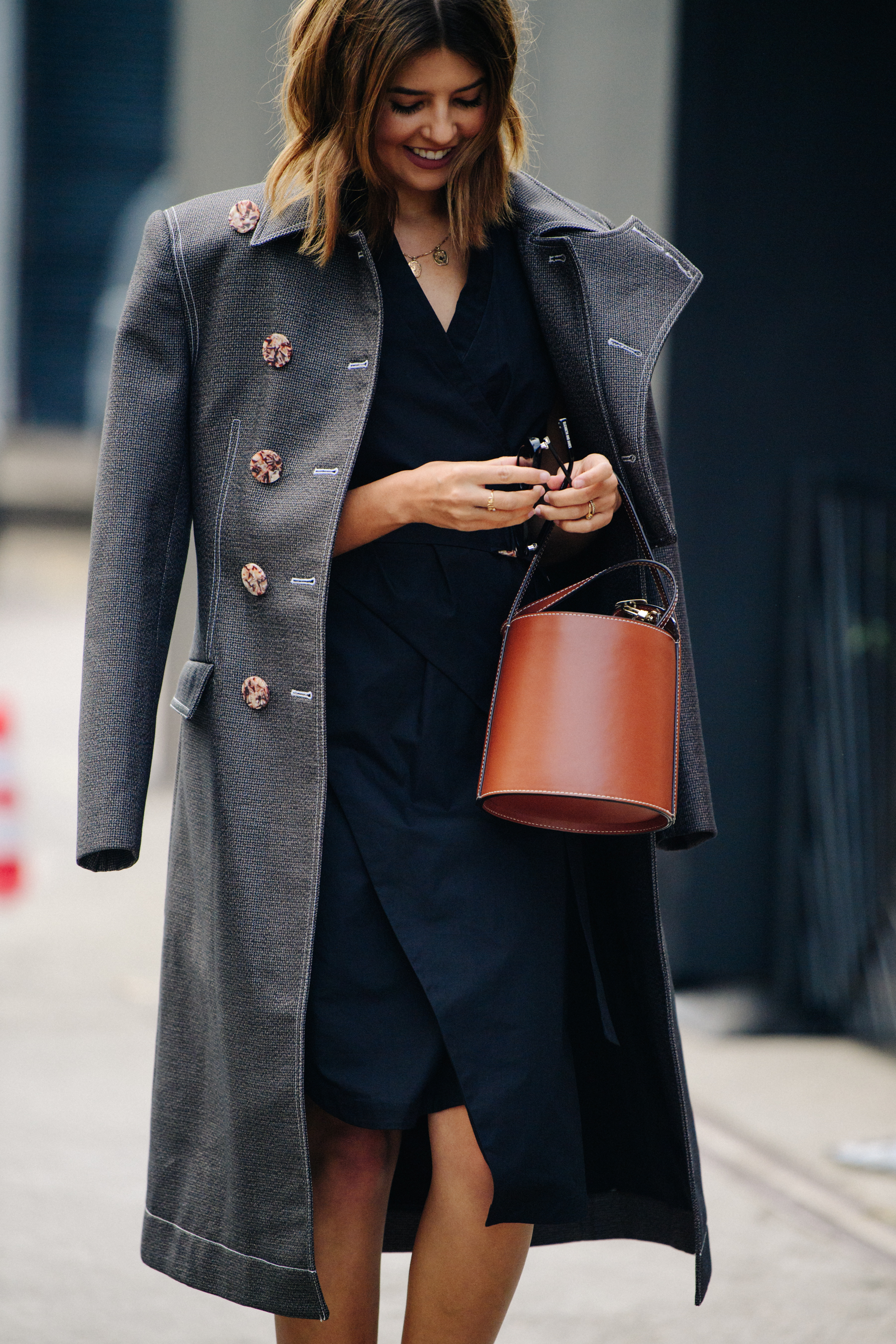 Woman wearing long grey coat