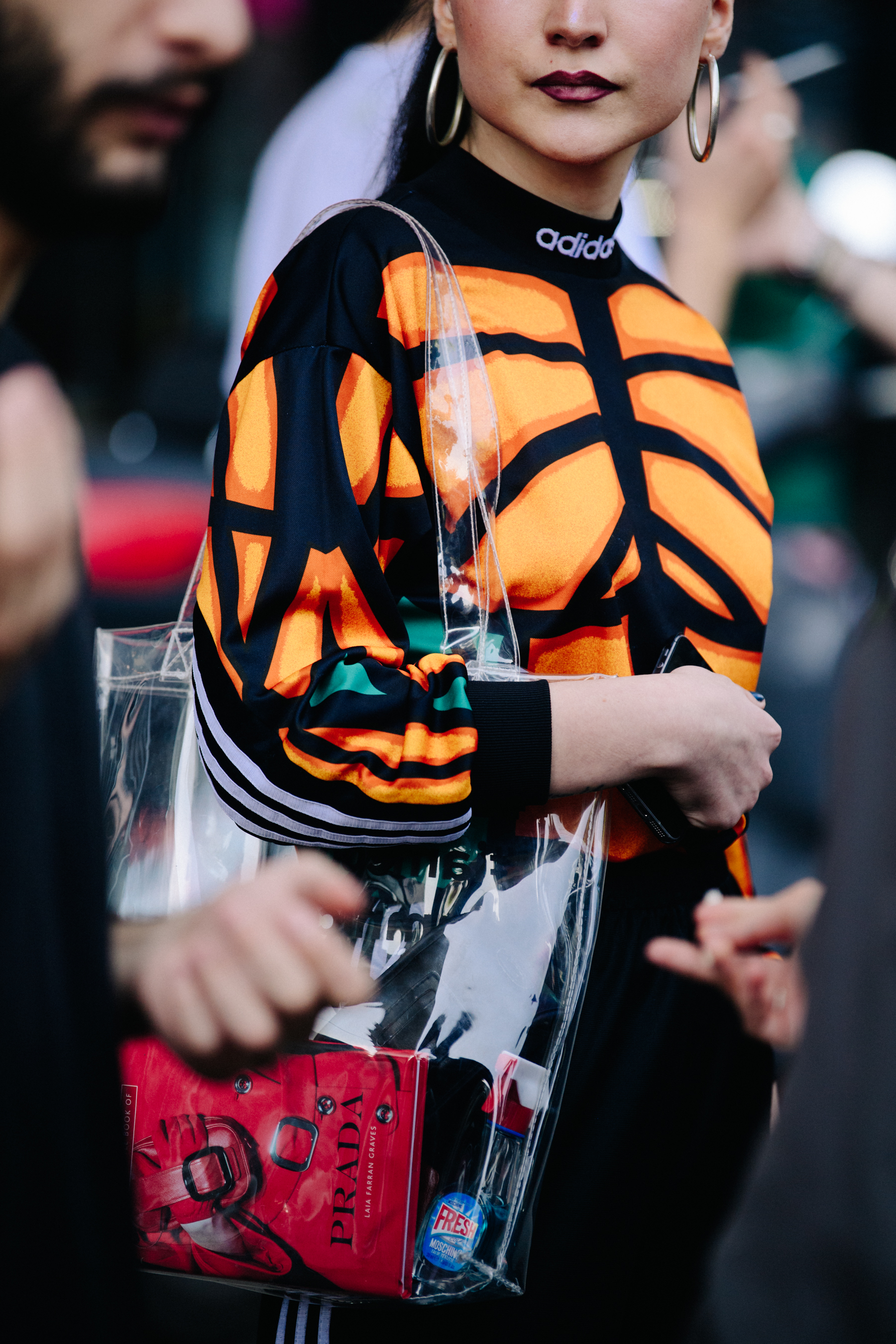 Woman wearing orange sports top