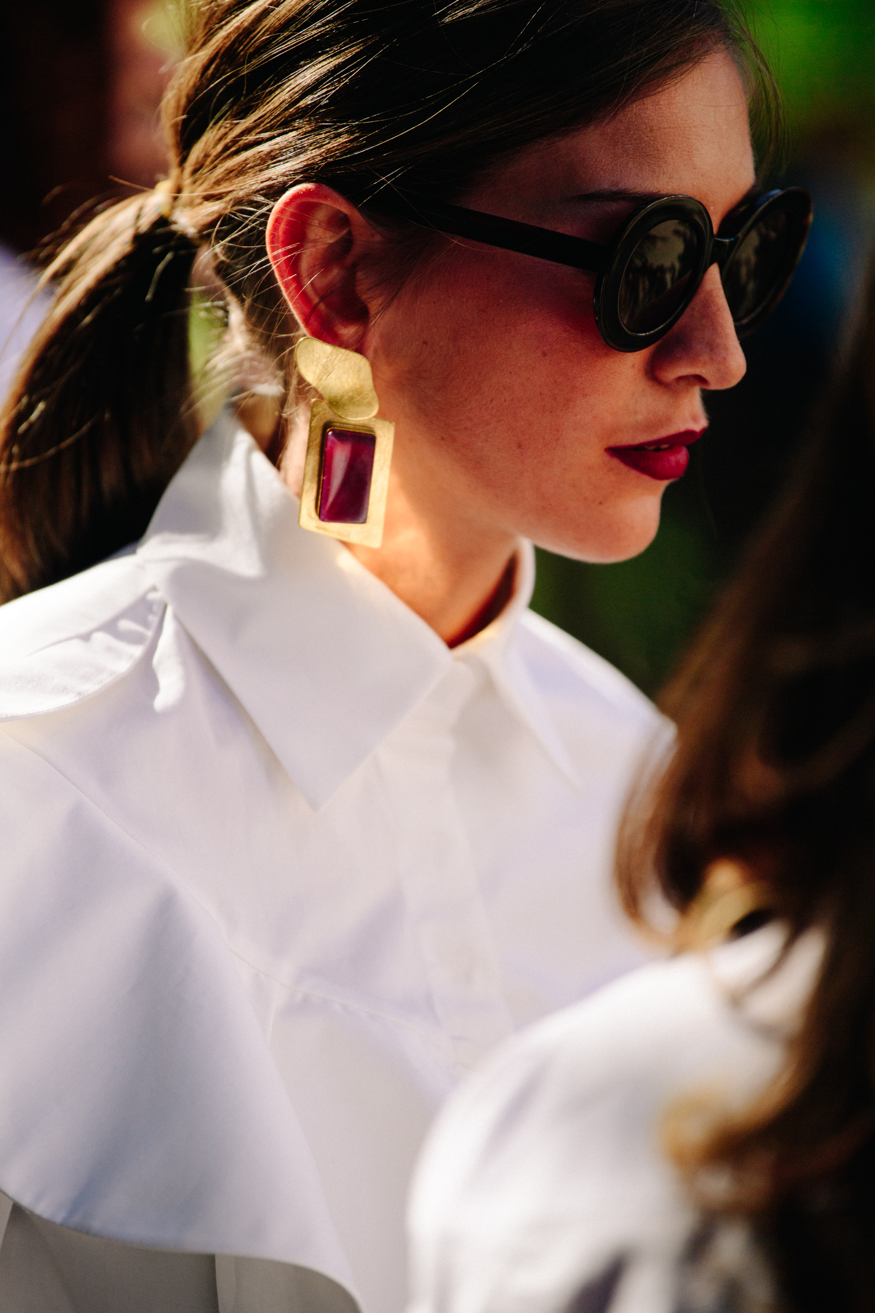 Woman wearing red earrings
