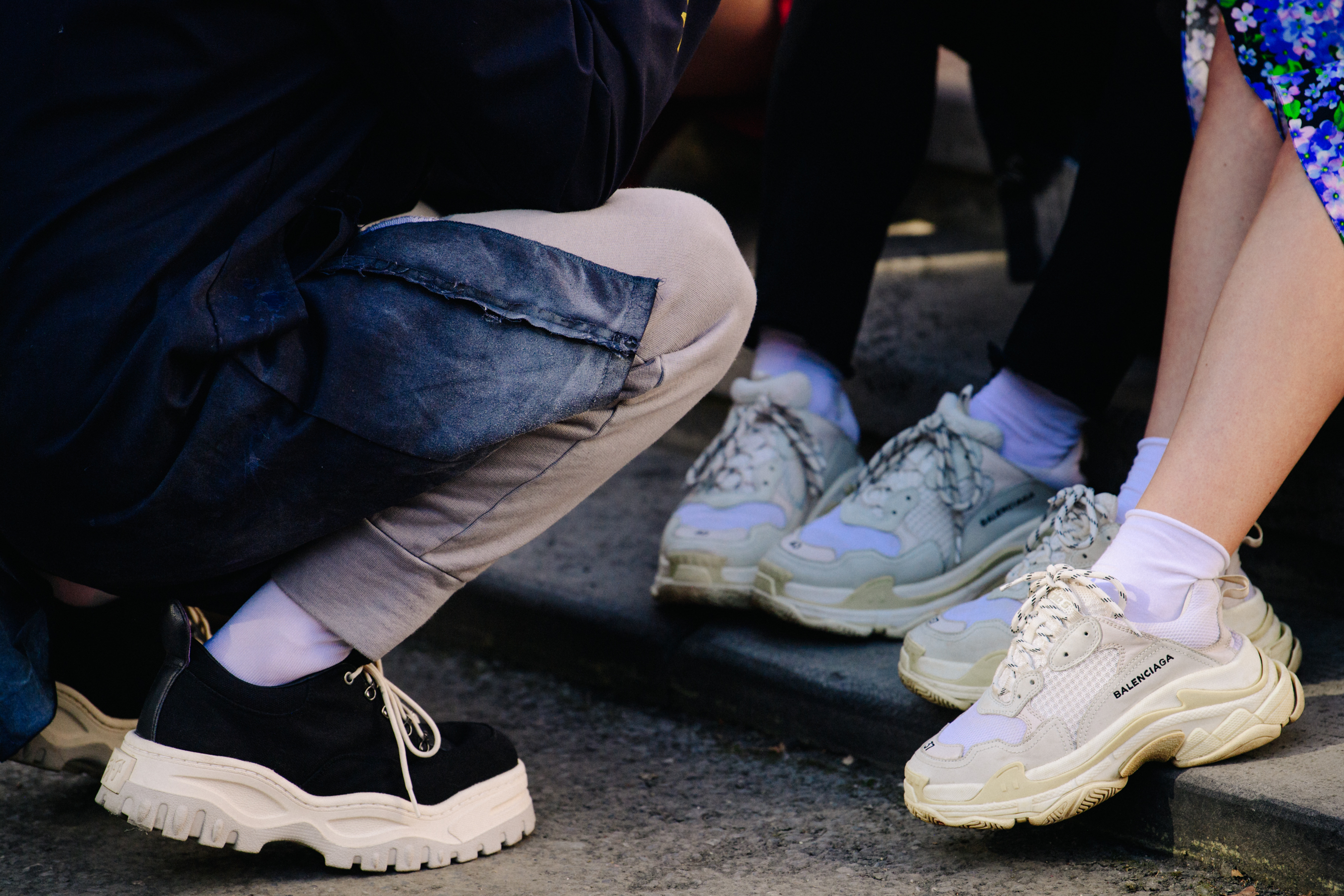 People wearing Balenciaga sneakers