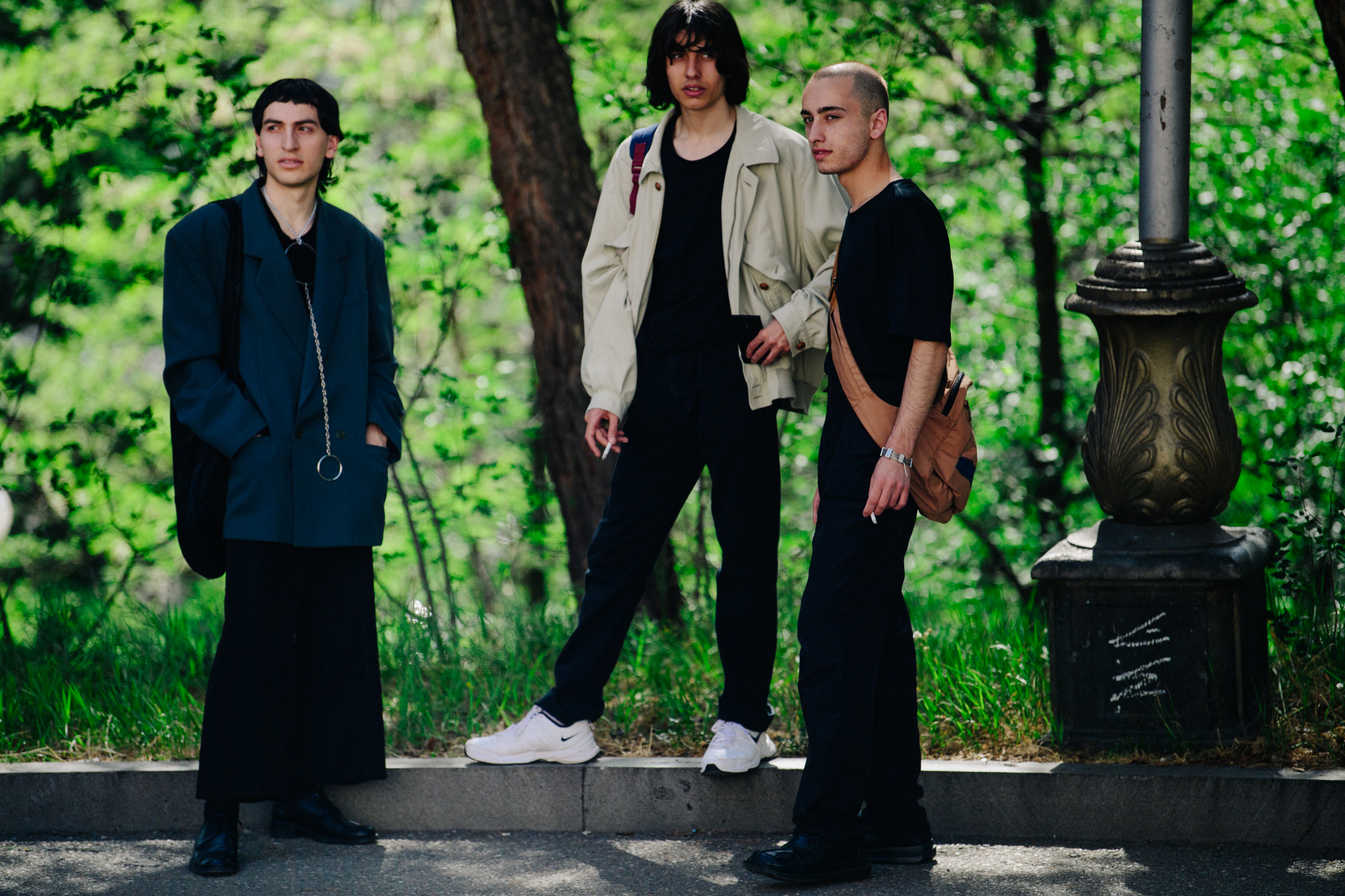 Three men wearing stylish outfits