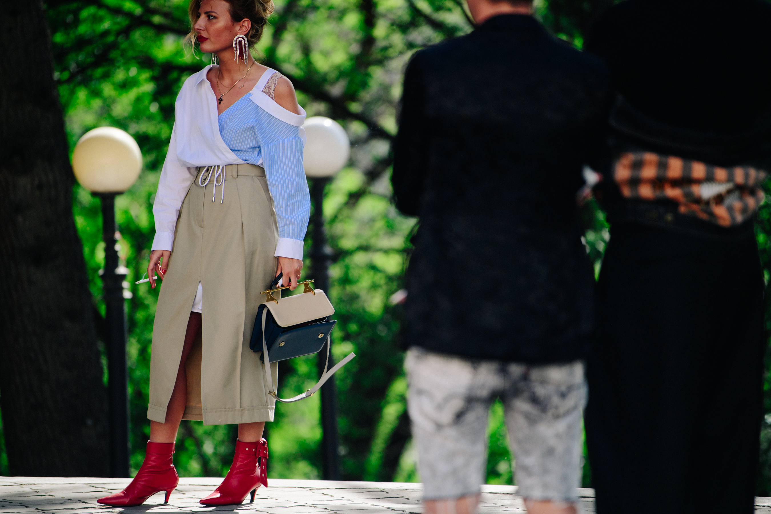 Woman wearing red heeled boots