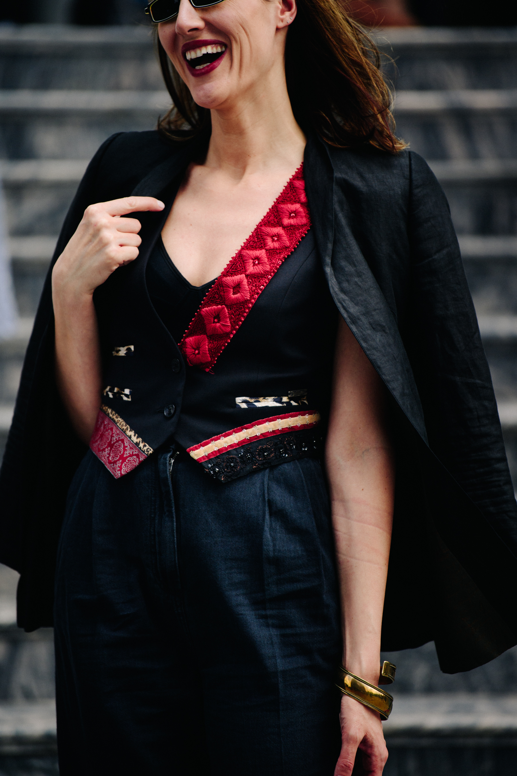 Woman wearing black and red suit