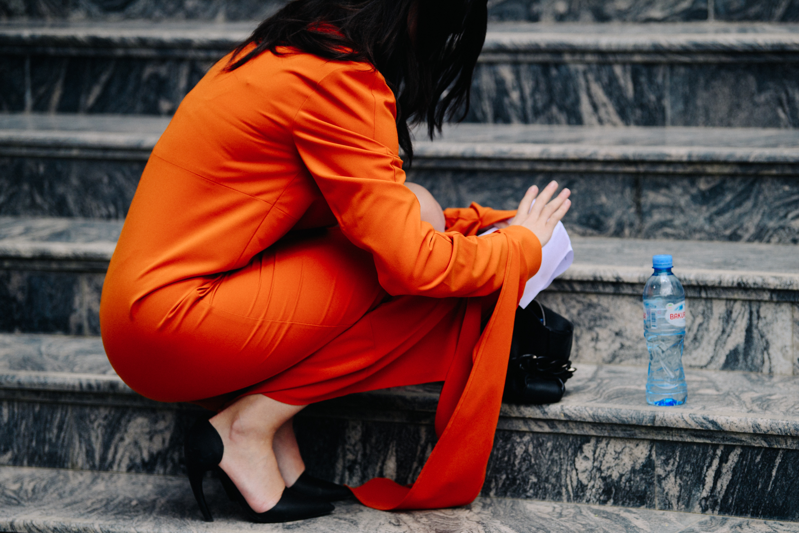 Woman wearing orange outfit