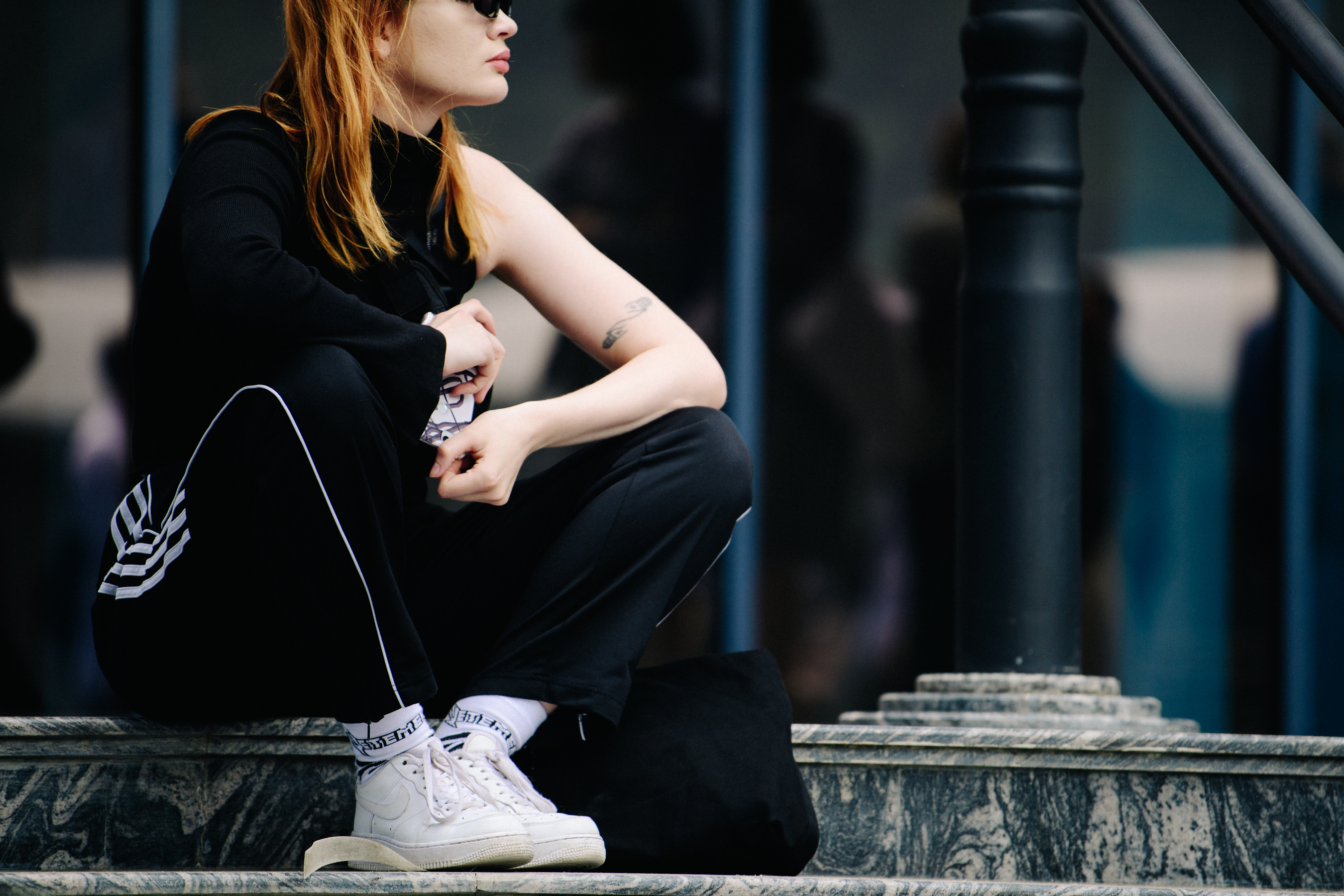 Woman wearing Adidas trackpants