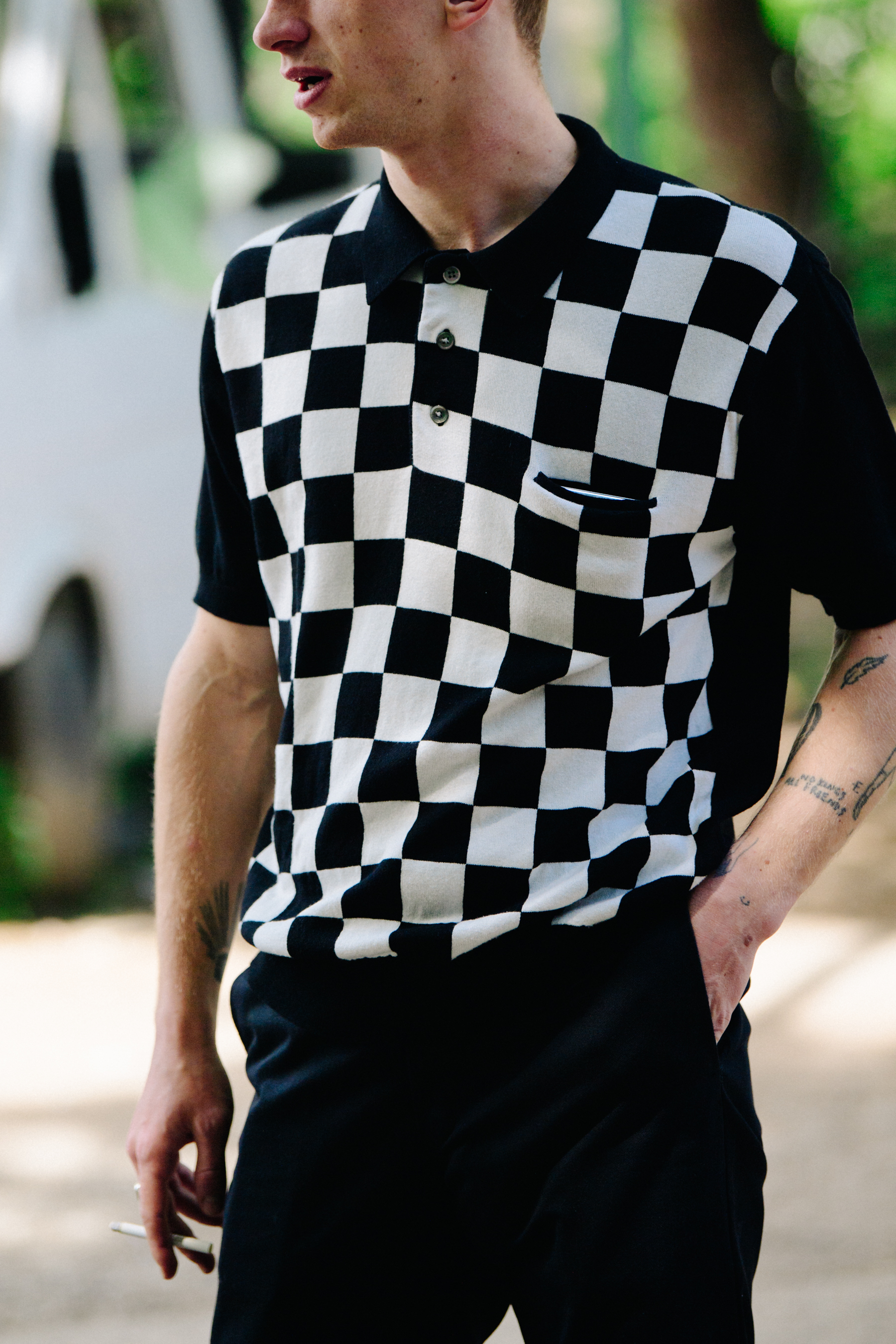 Man wearing check top