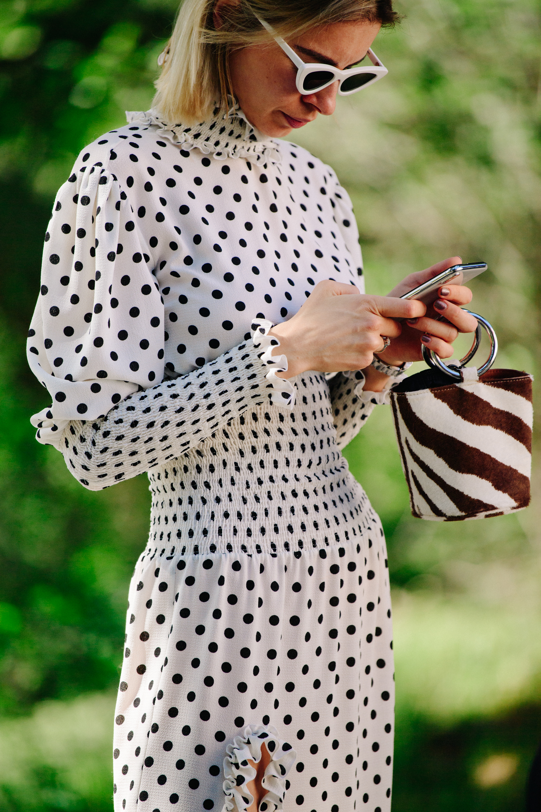 Woman wearing white spotted outfit