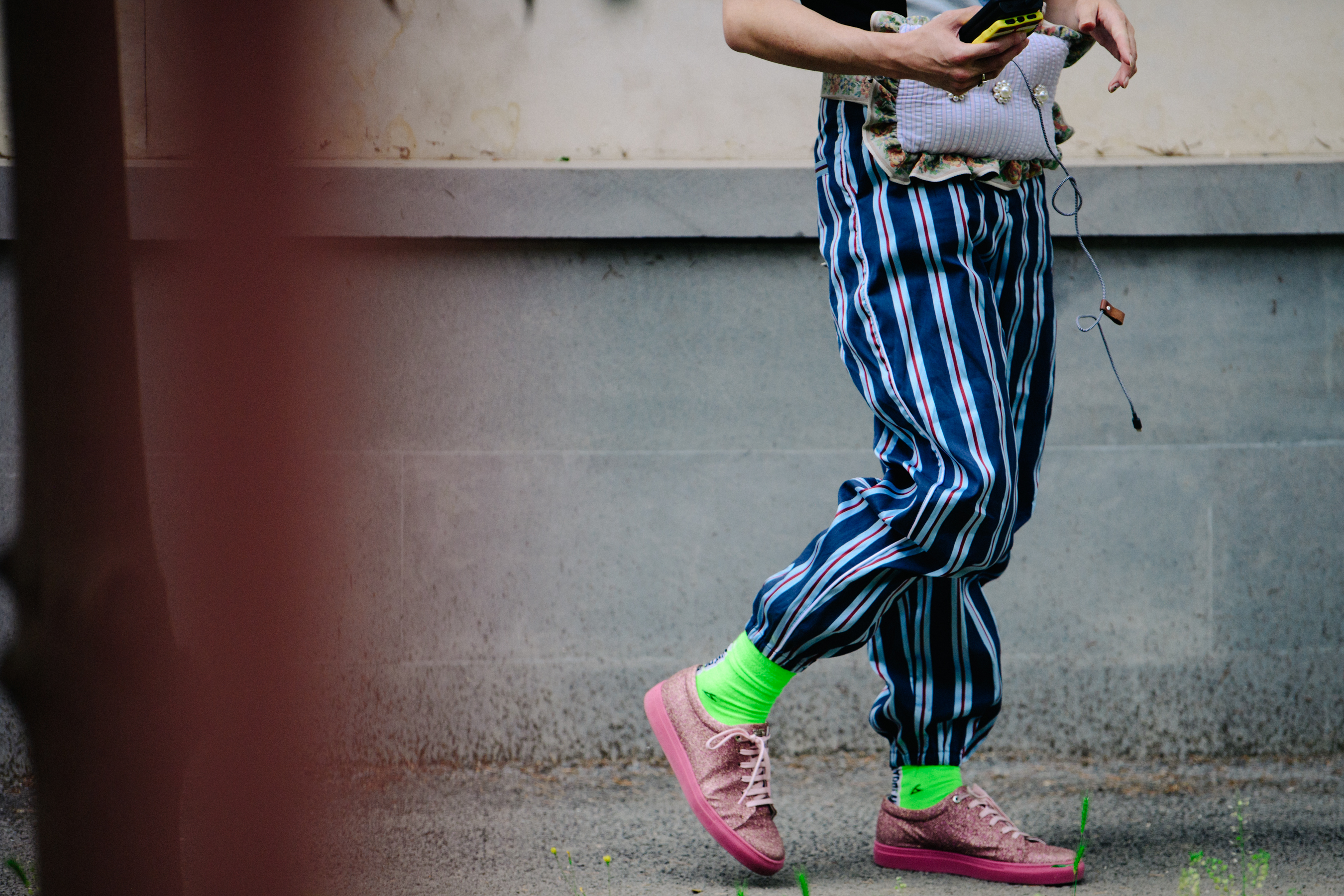 Japanese buyer wearing pink sneakers