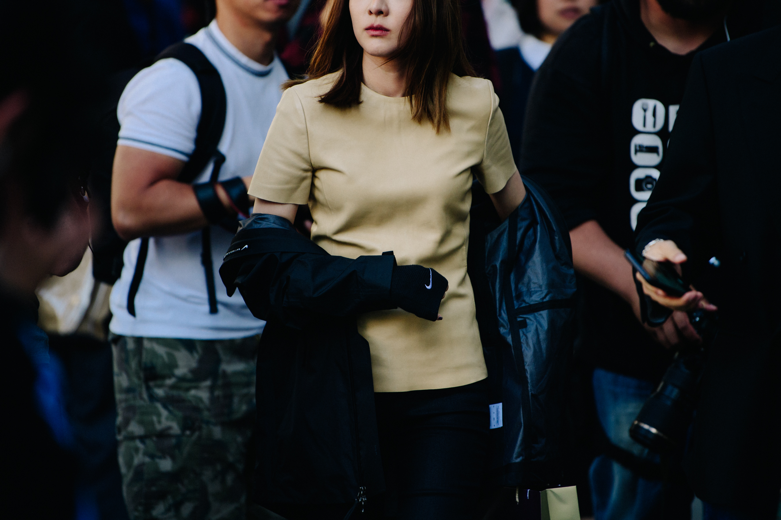 Asian woman wearing Nike coat