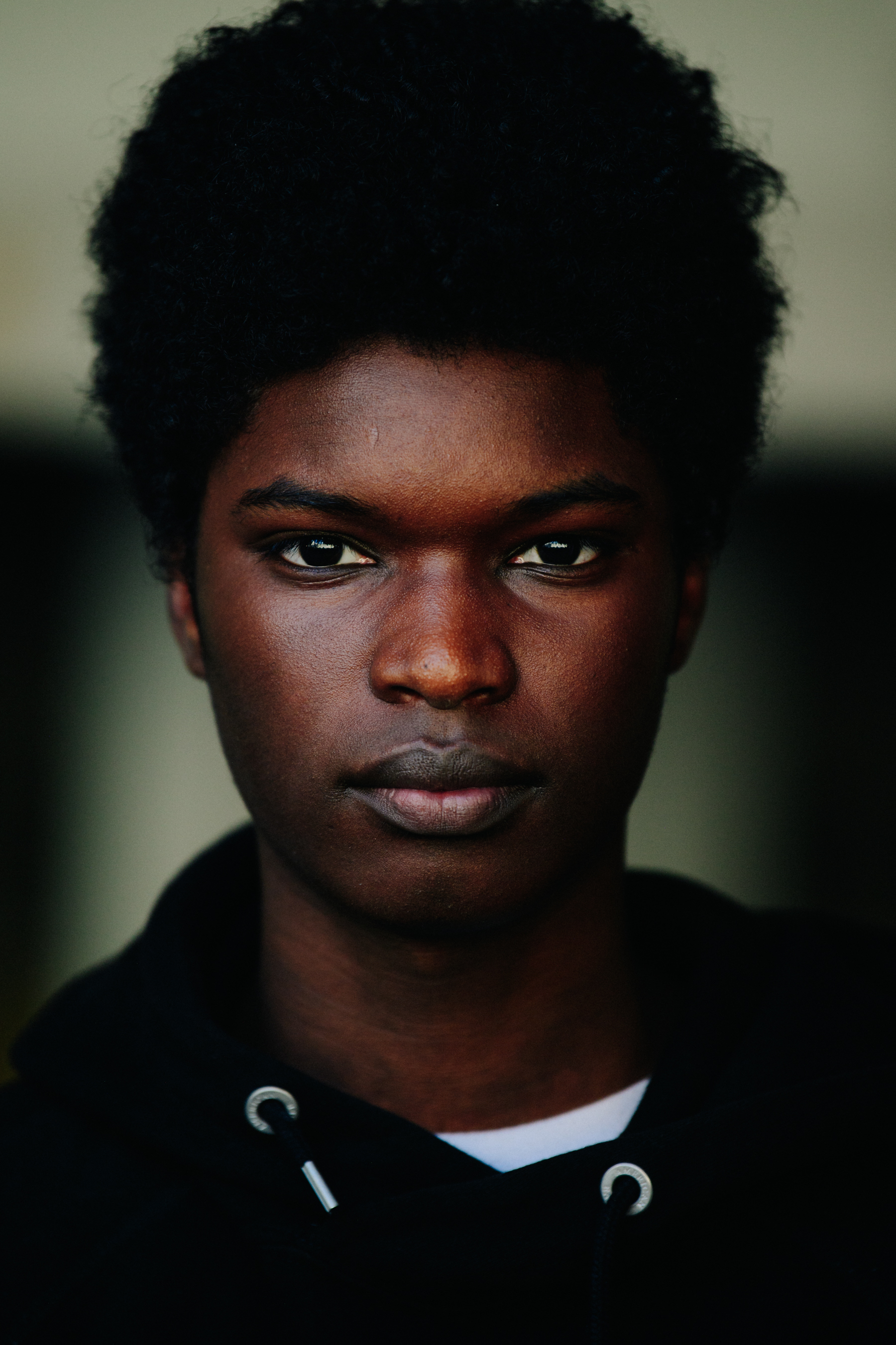 Portrait of model with thick black hair