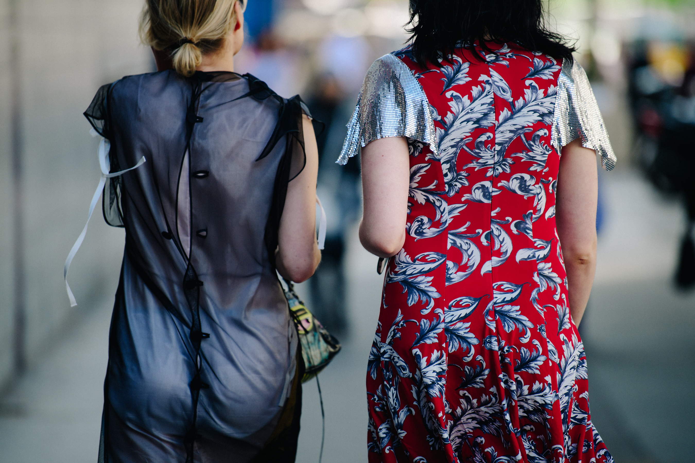 Two women wearing dresses