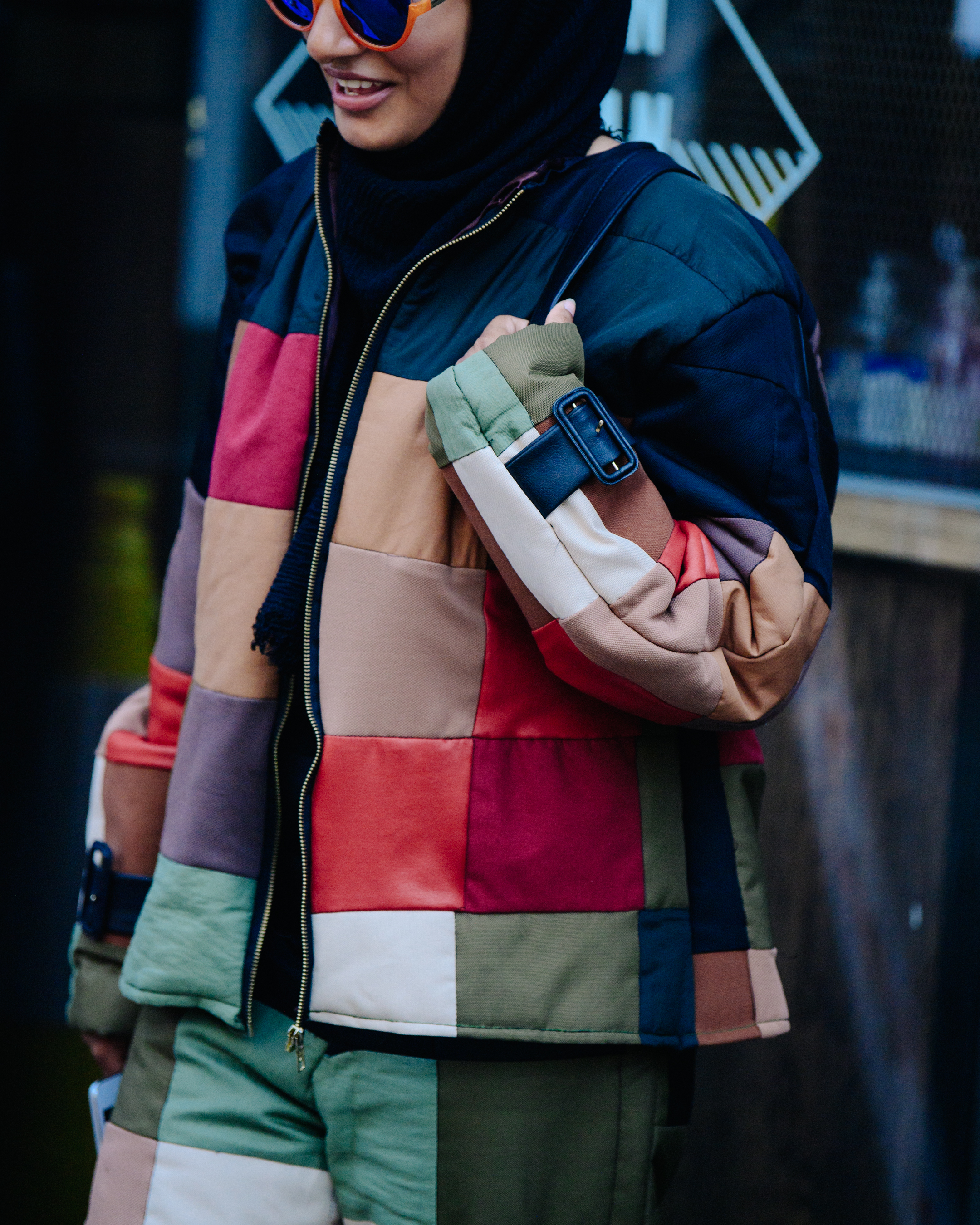 Woman wearing patched jacket