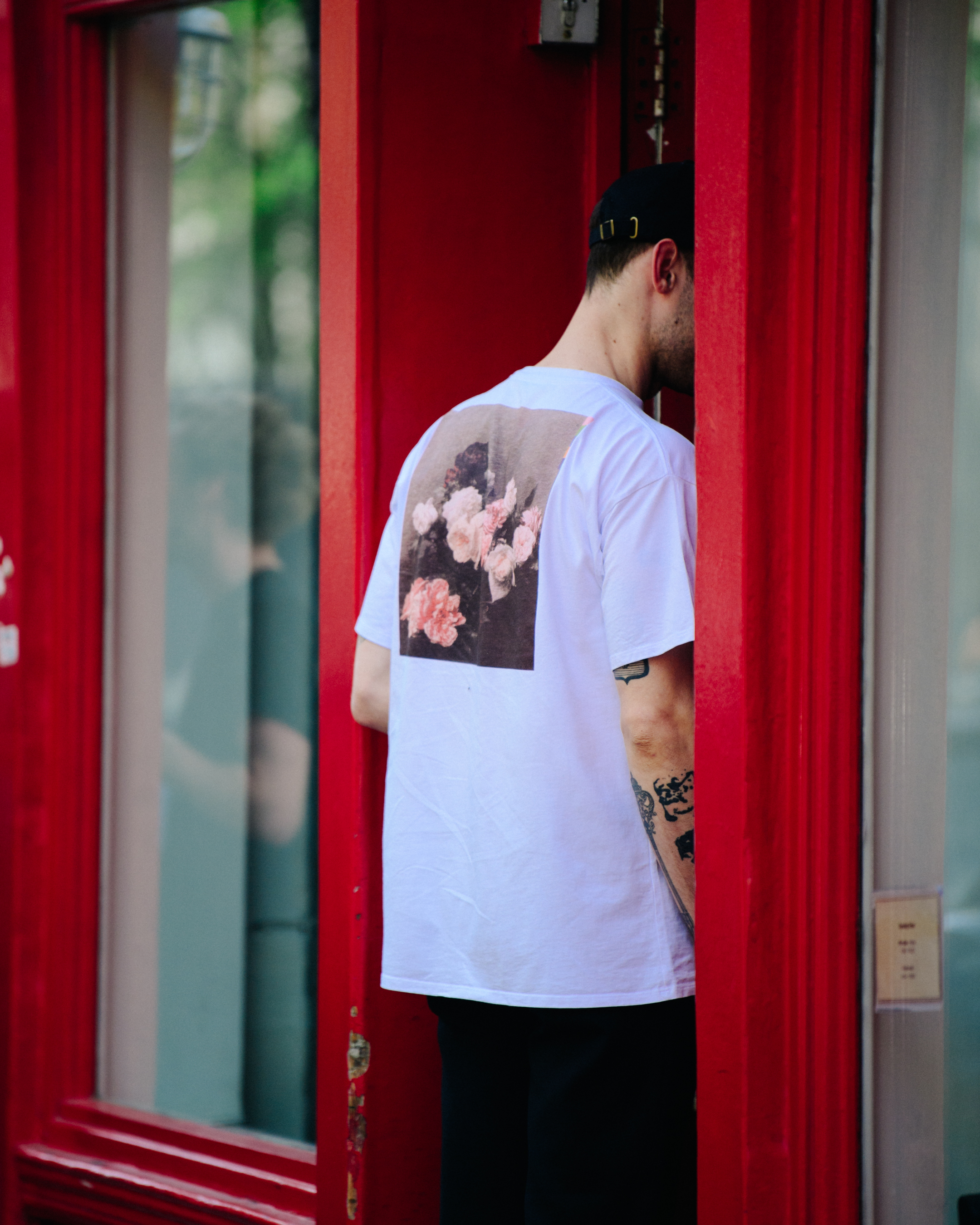 Man wearing white floral print tee