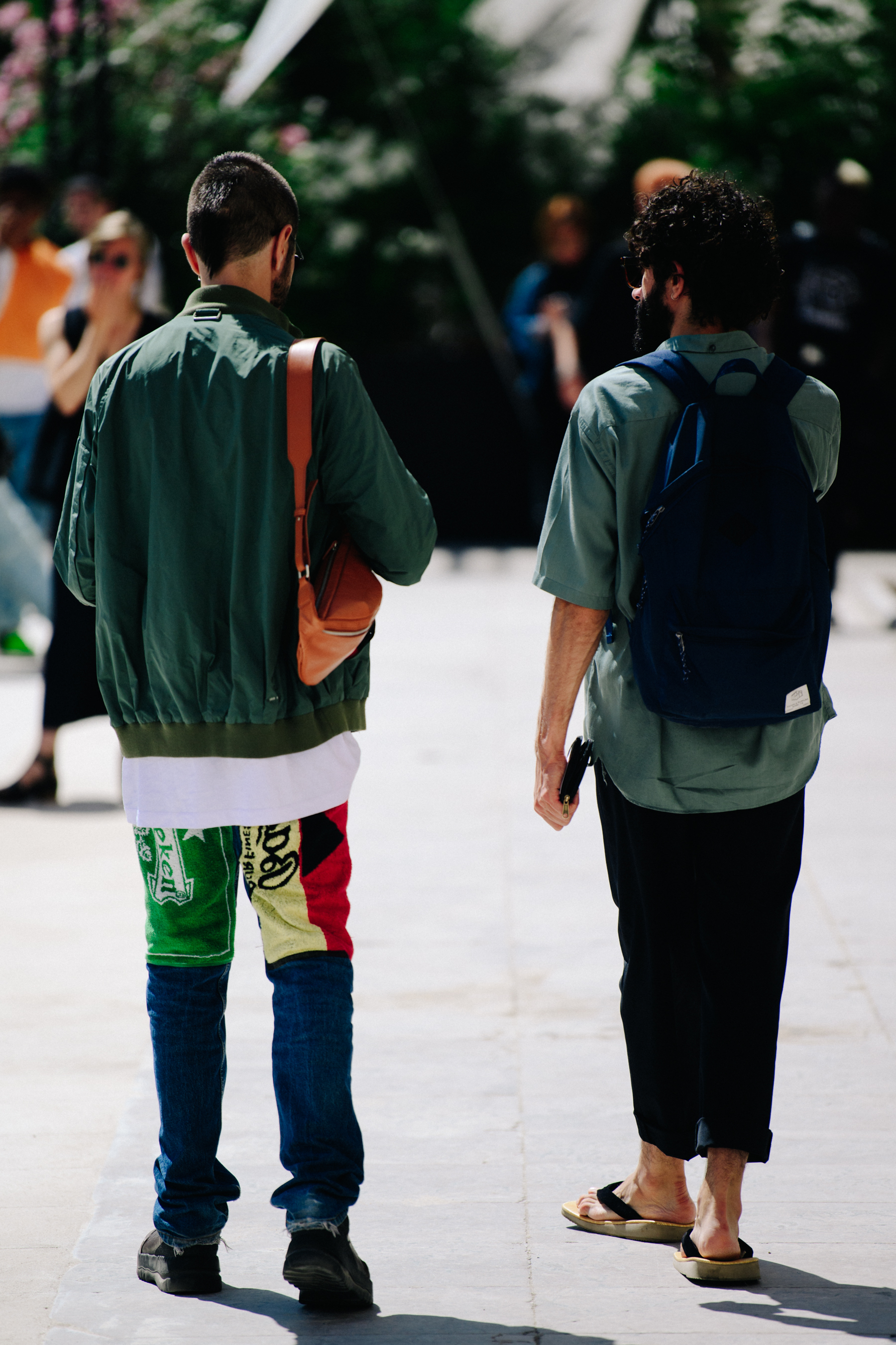 Two men wearing green tops