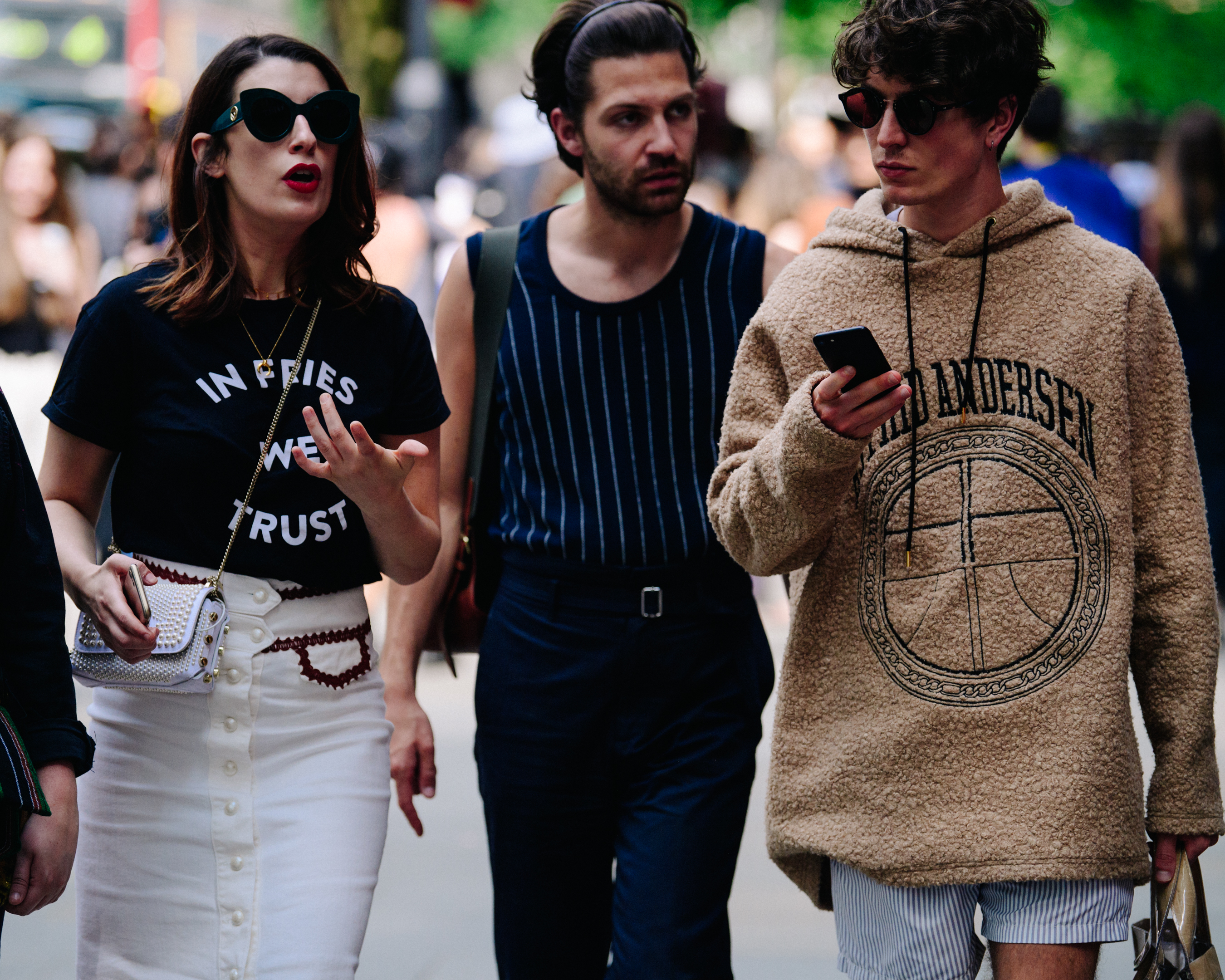 Three people wearing stylish clothing