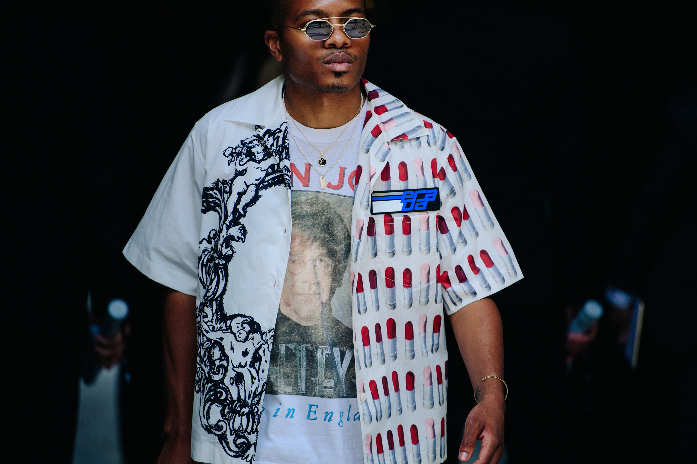 Man wearing white Prada shirt