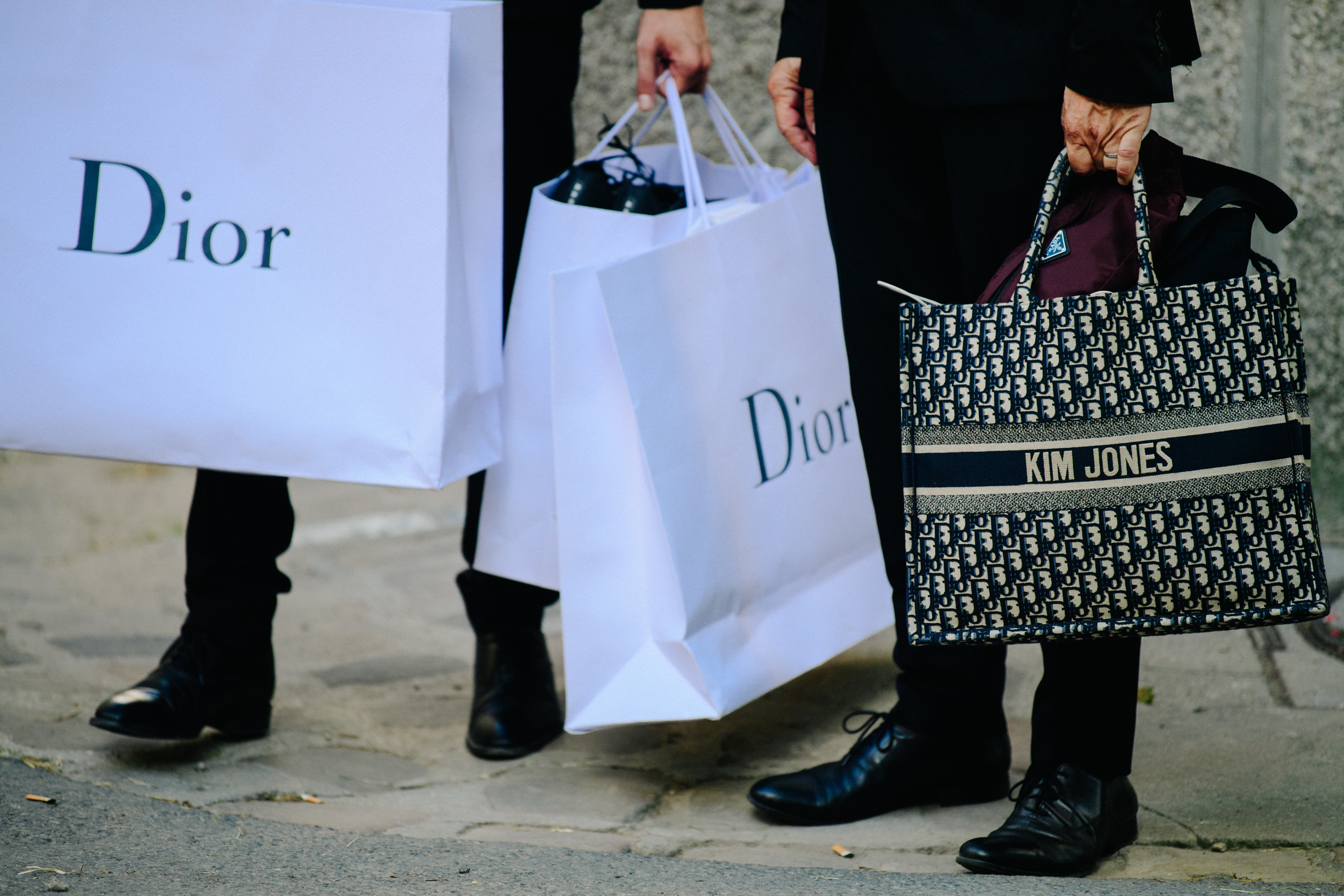 Man carrying Kim Jones Christian Dior bag