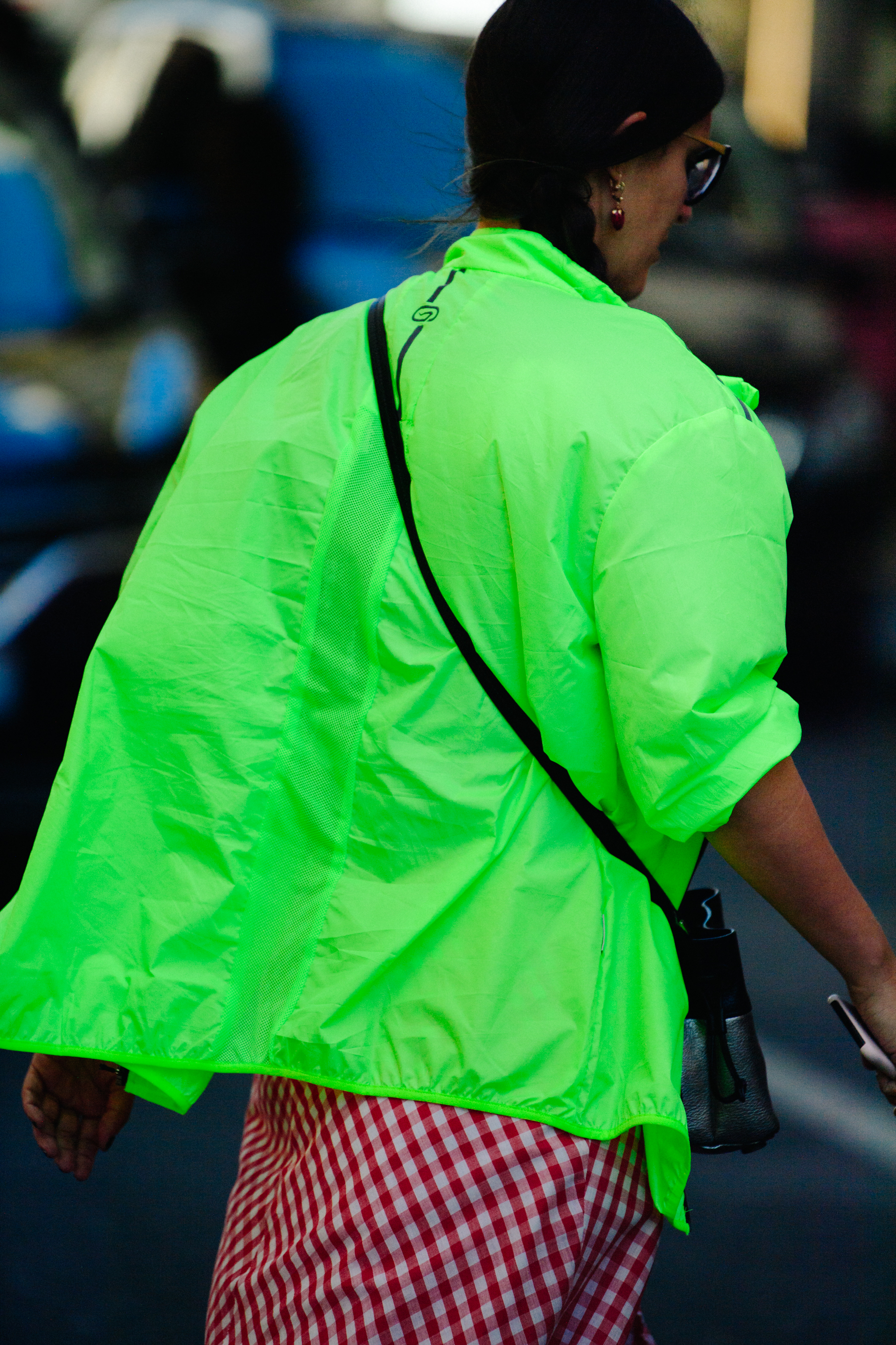 Woman wearing green windbreaker