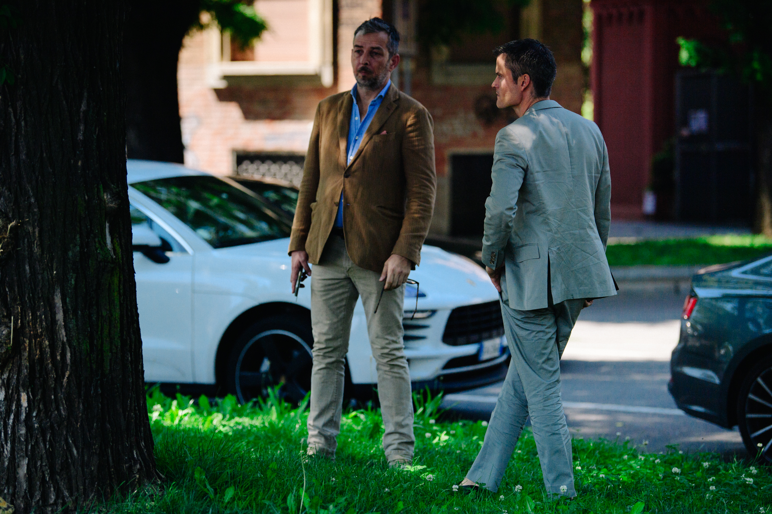 Two men wearing suits