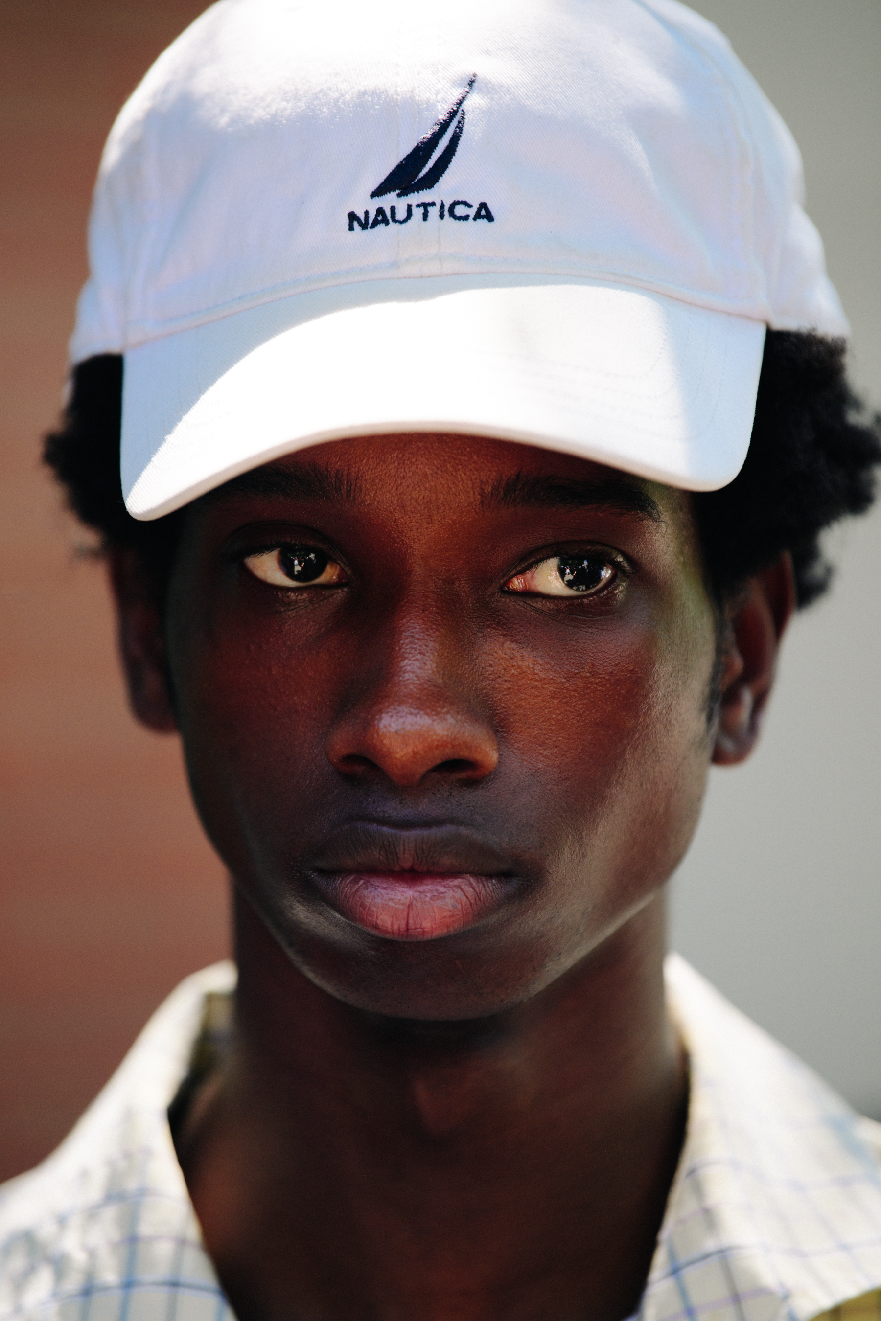 Portrait of model wearing white cap