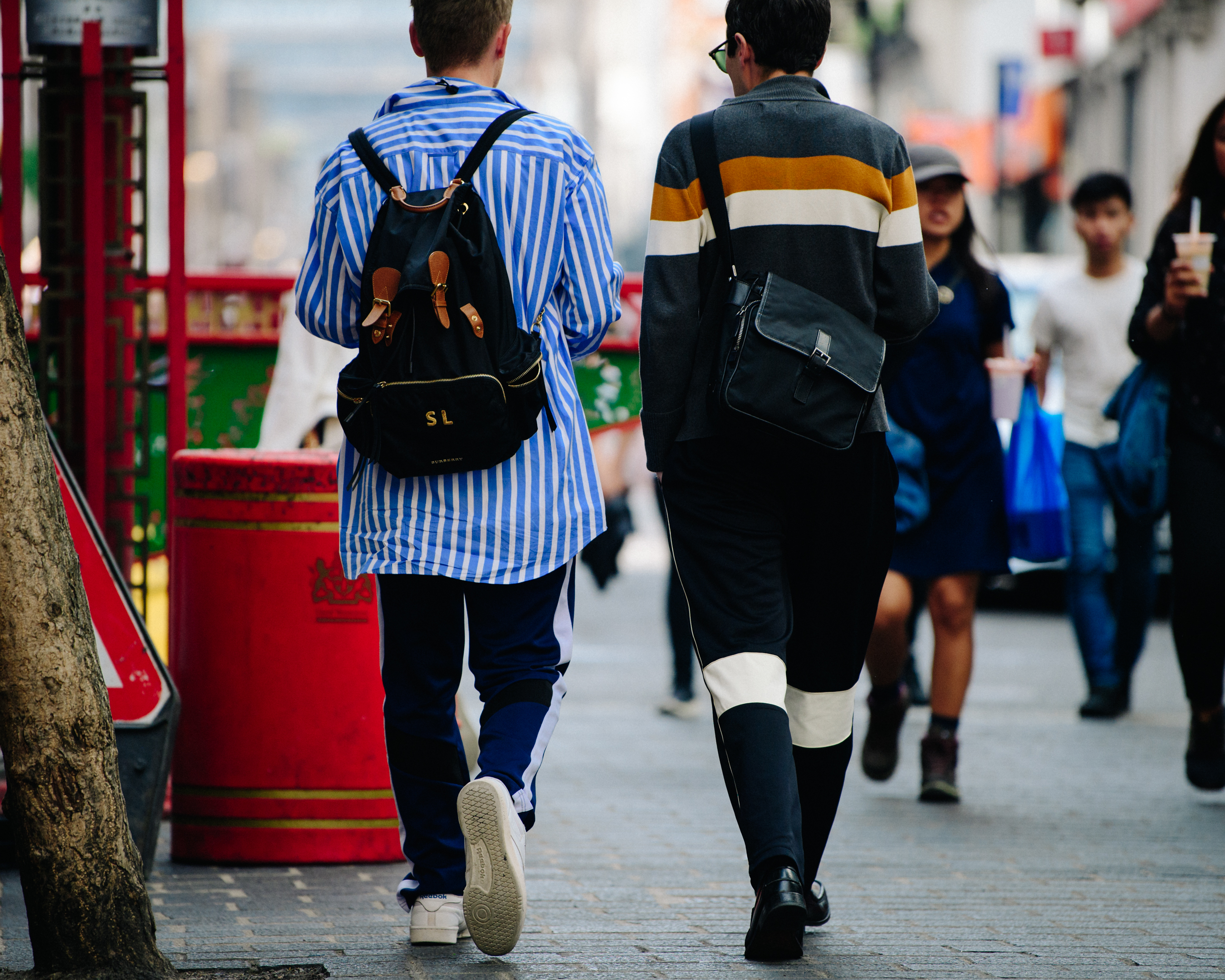 Two men wearing striped outfits