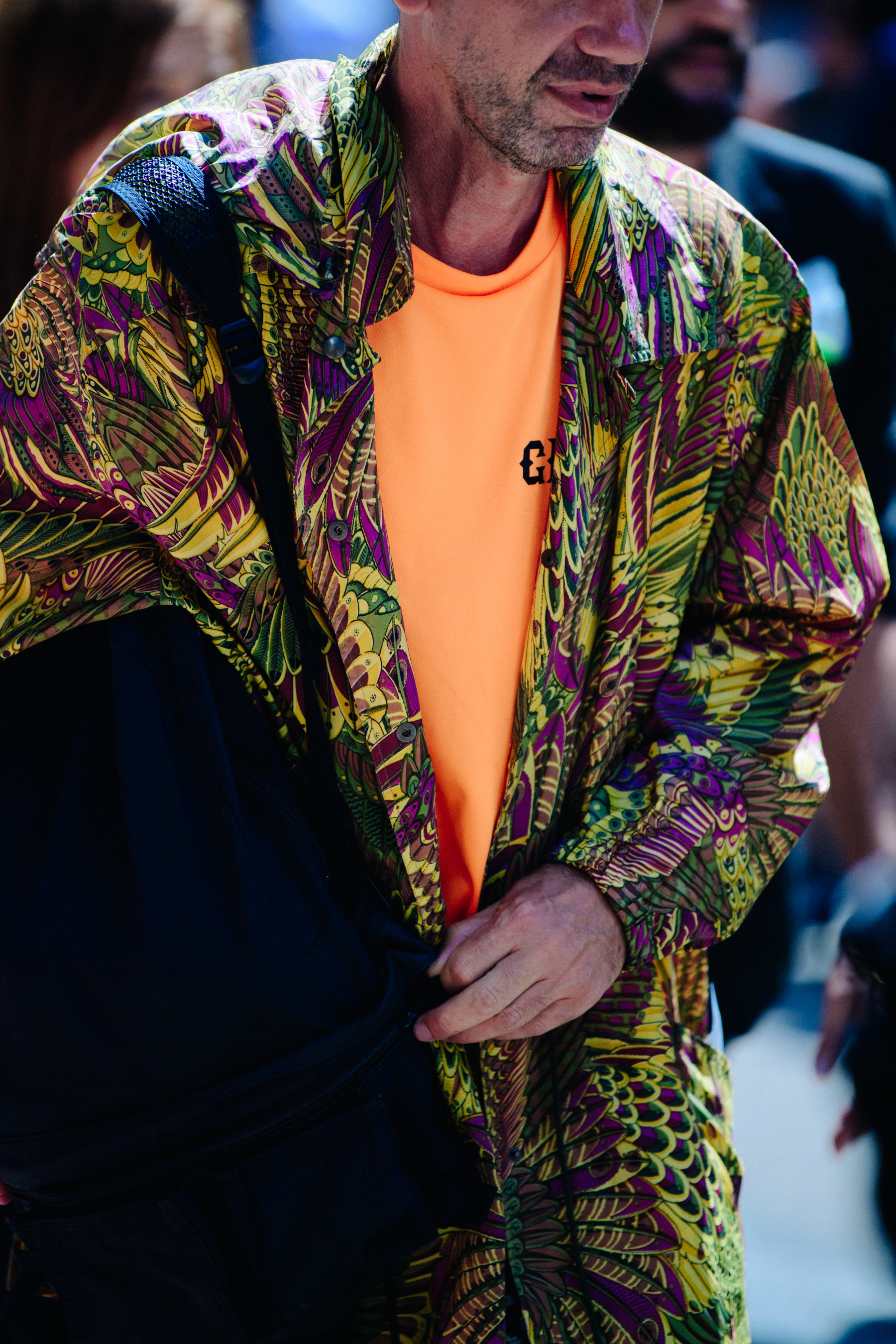 Man wearing colourful pattern shirt
