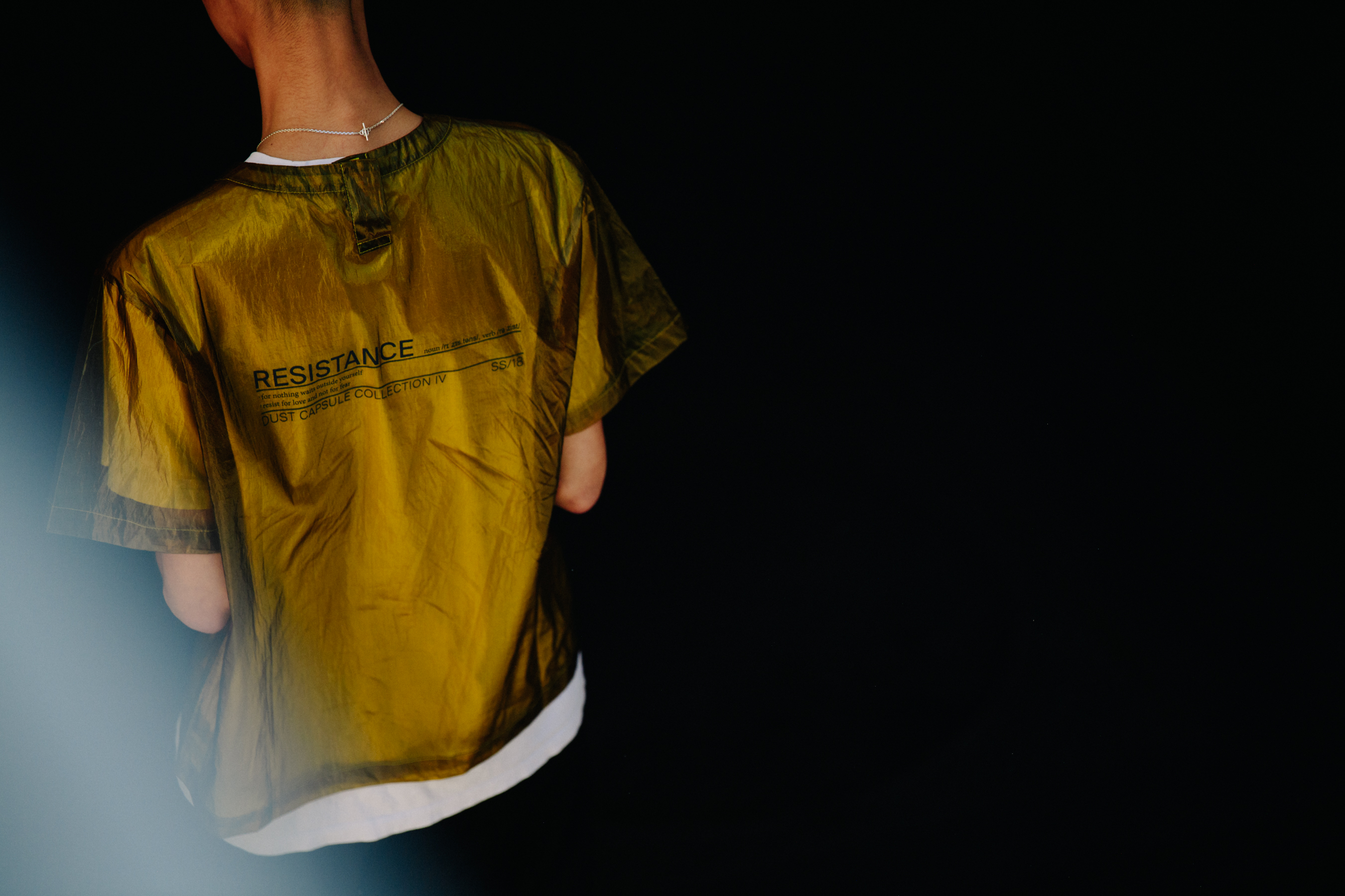 Man wearing yellow tee shirt