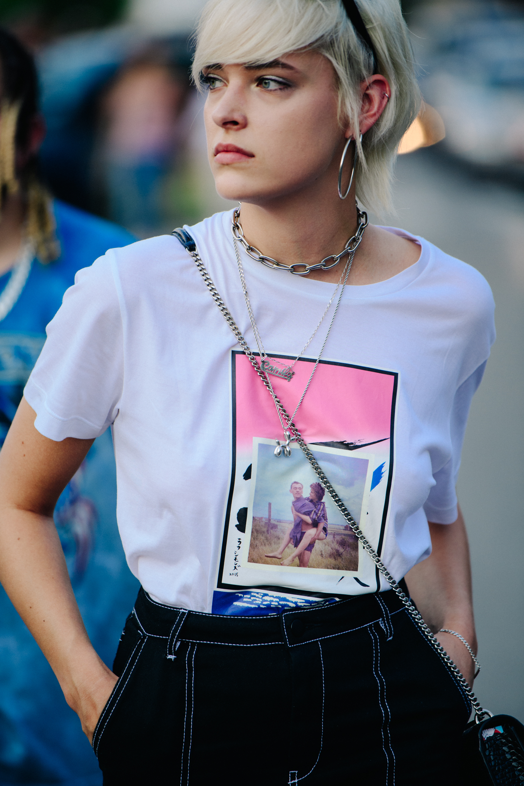 Woman wearing white graphic tee shirt