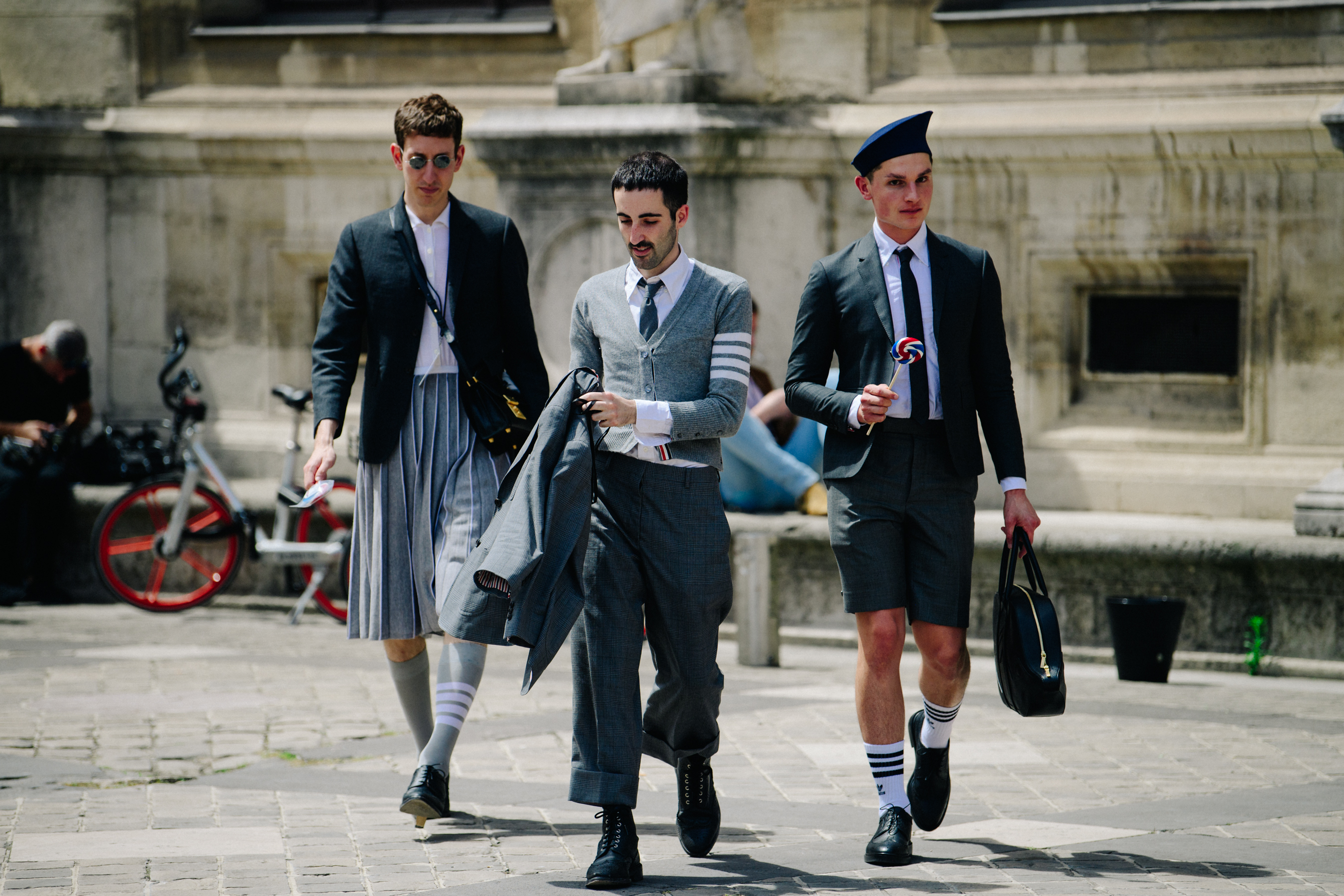 Three men wearing Thom Browne