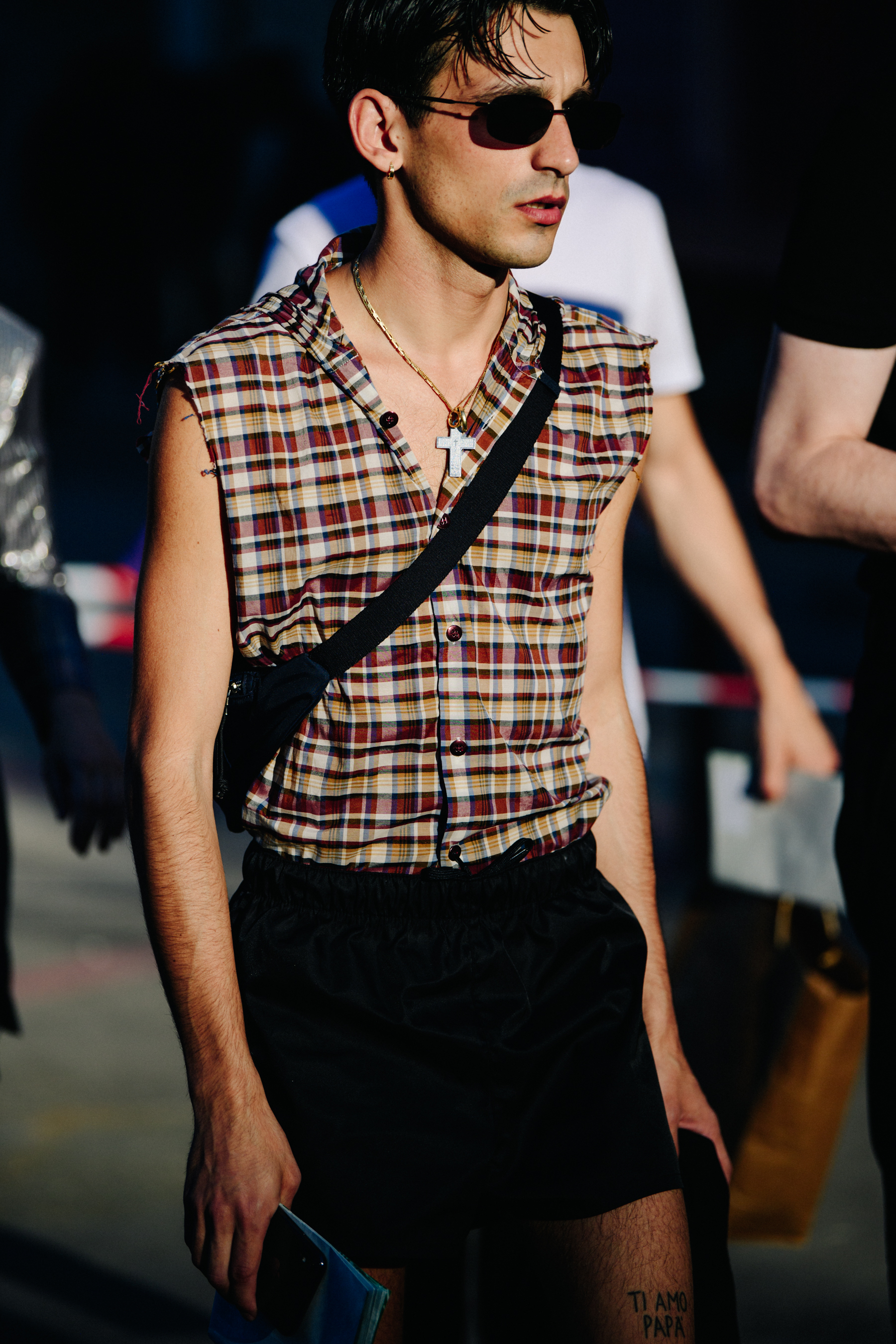 Man wearing large cross necklace