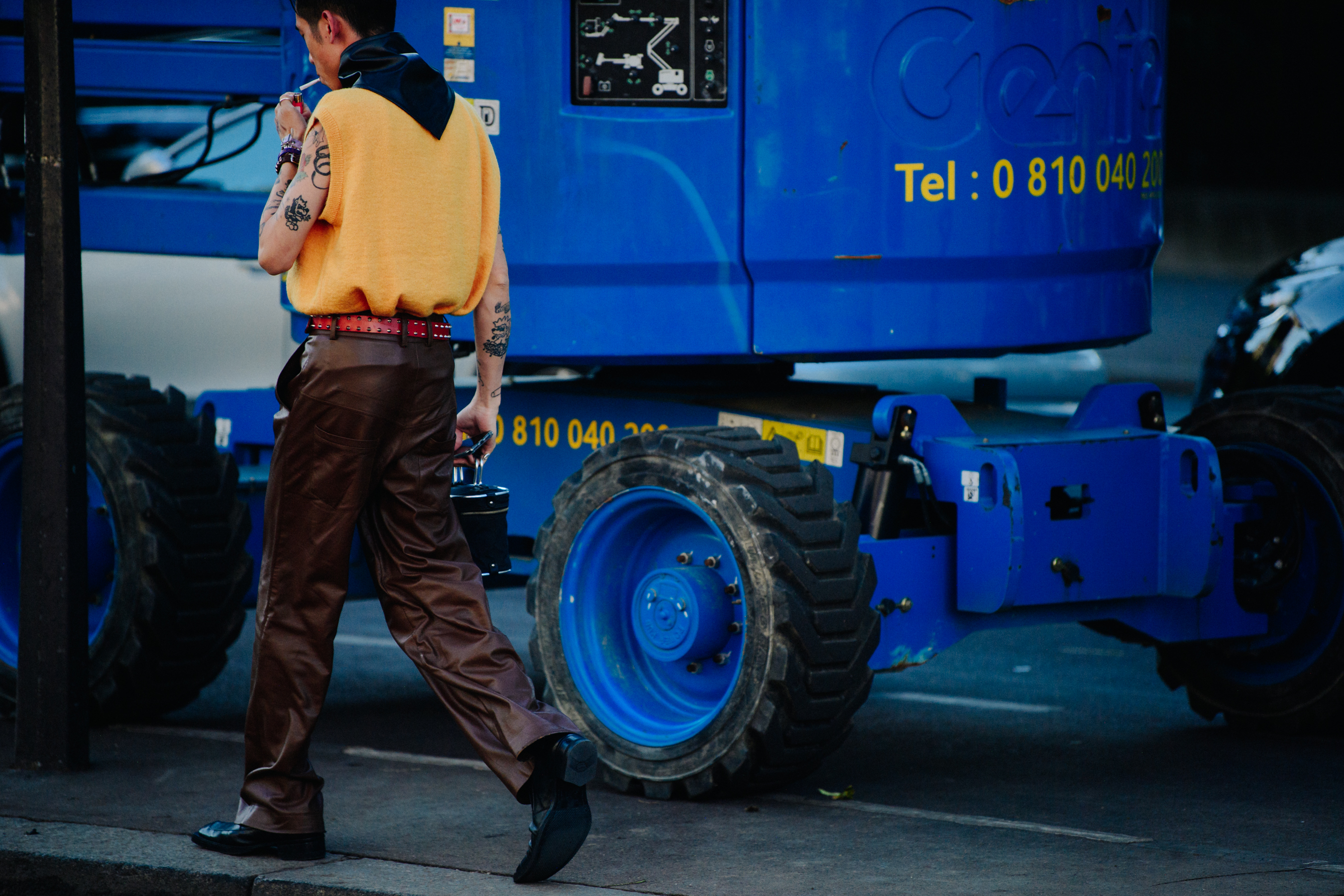 Man wearing brown leather pants