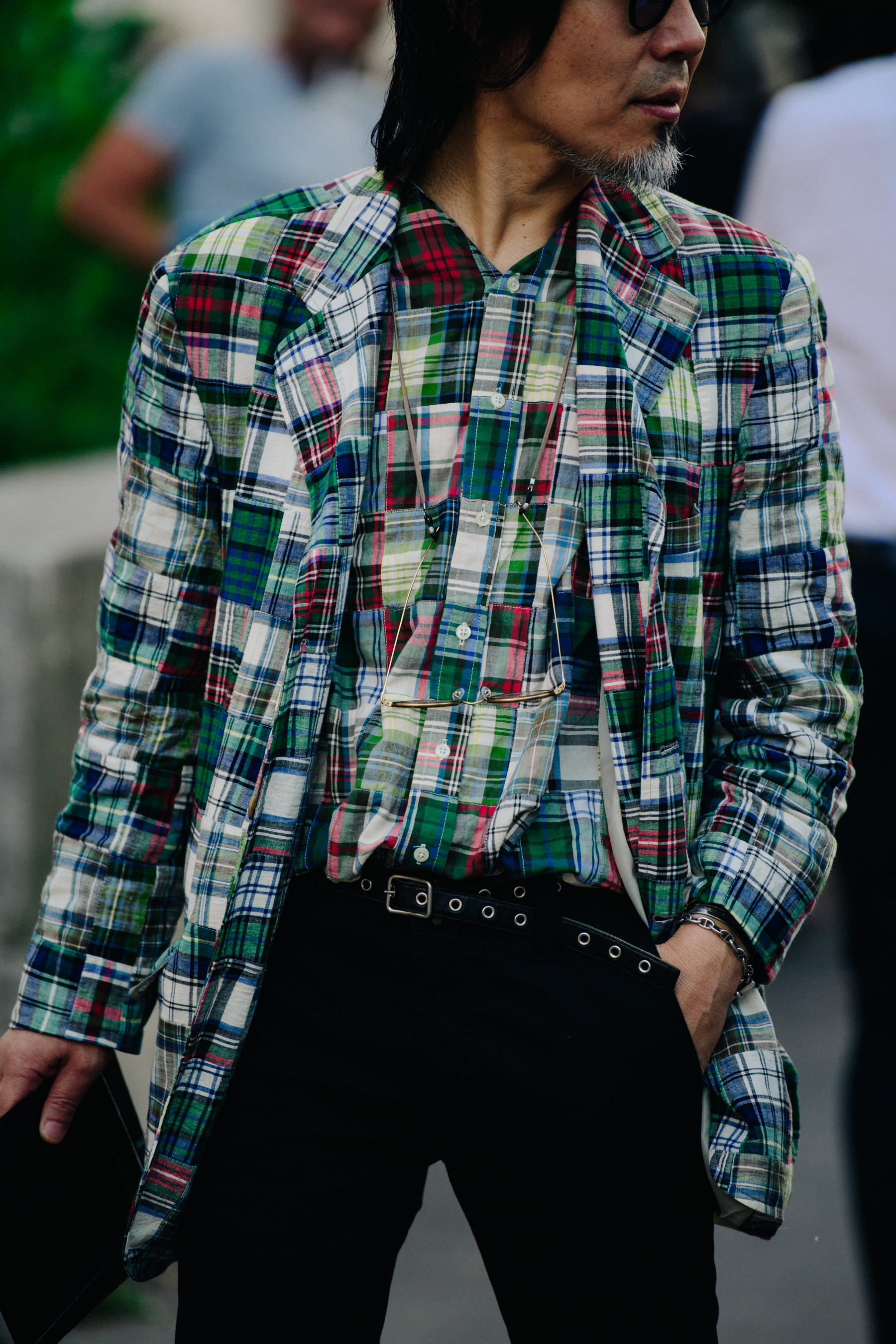 Asian man wearing check blazer