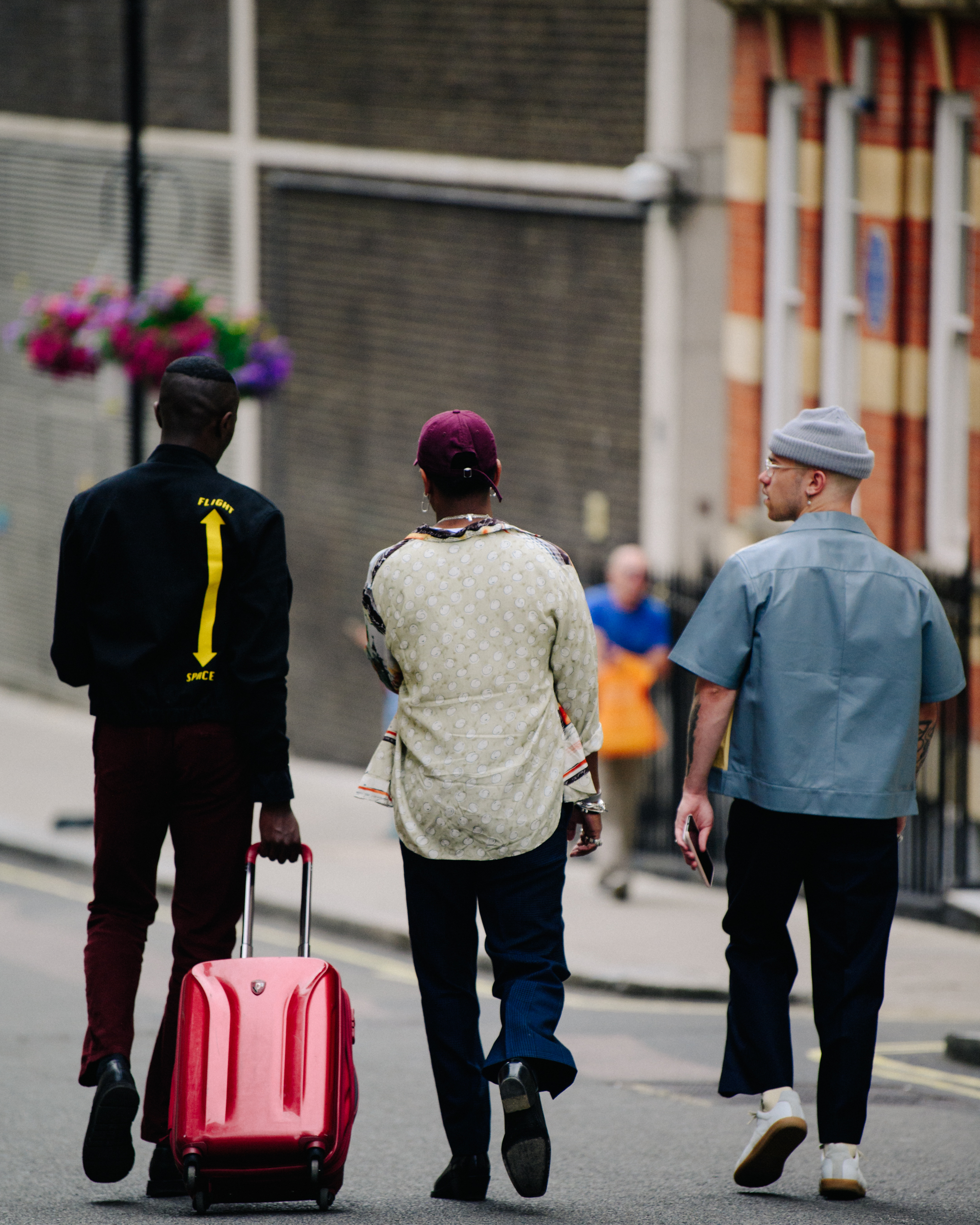 Three men wearing shirts