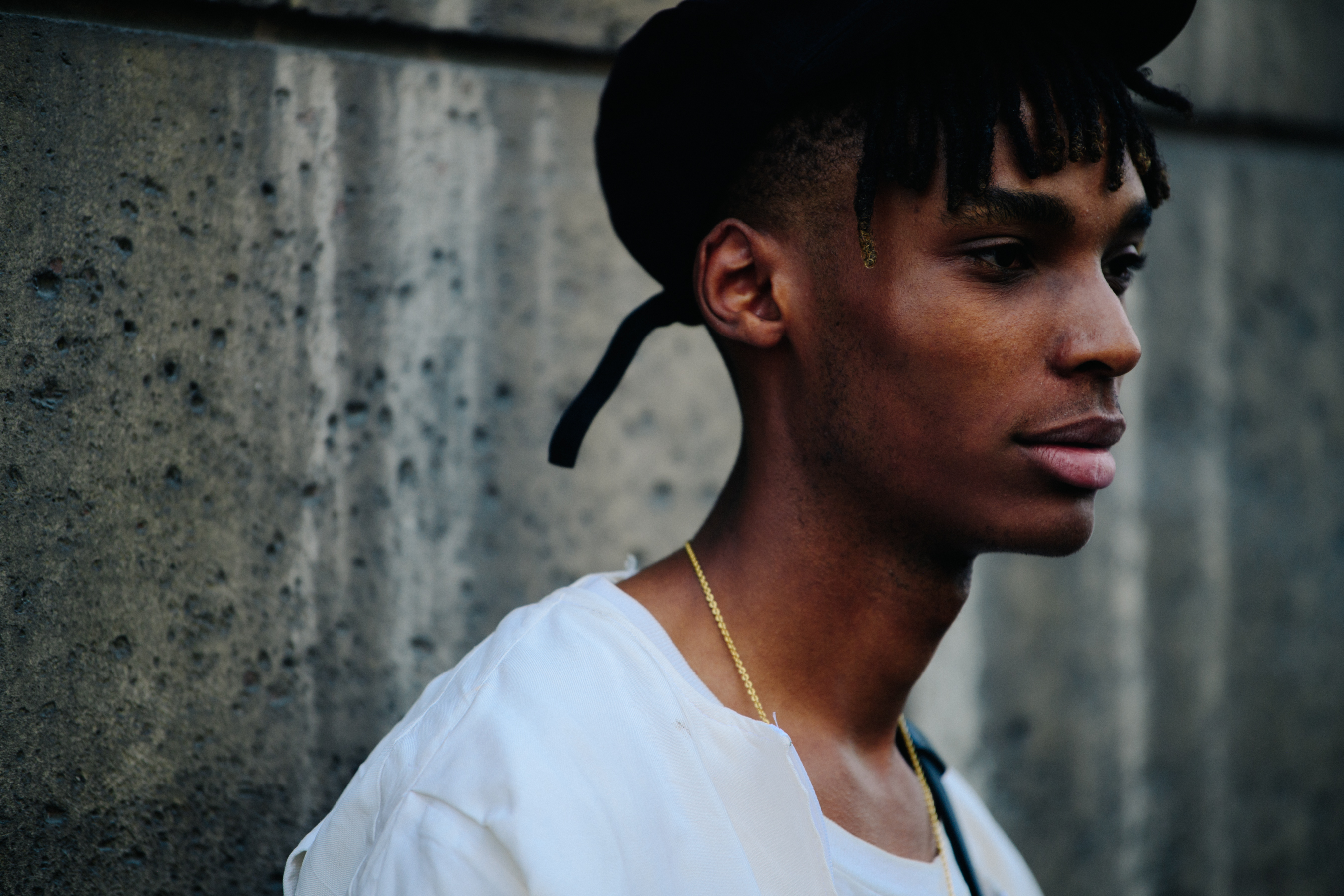 Male model wearing black cap