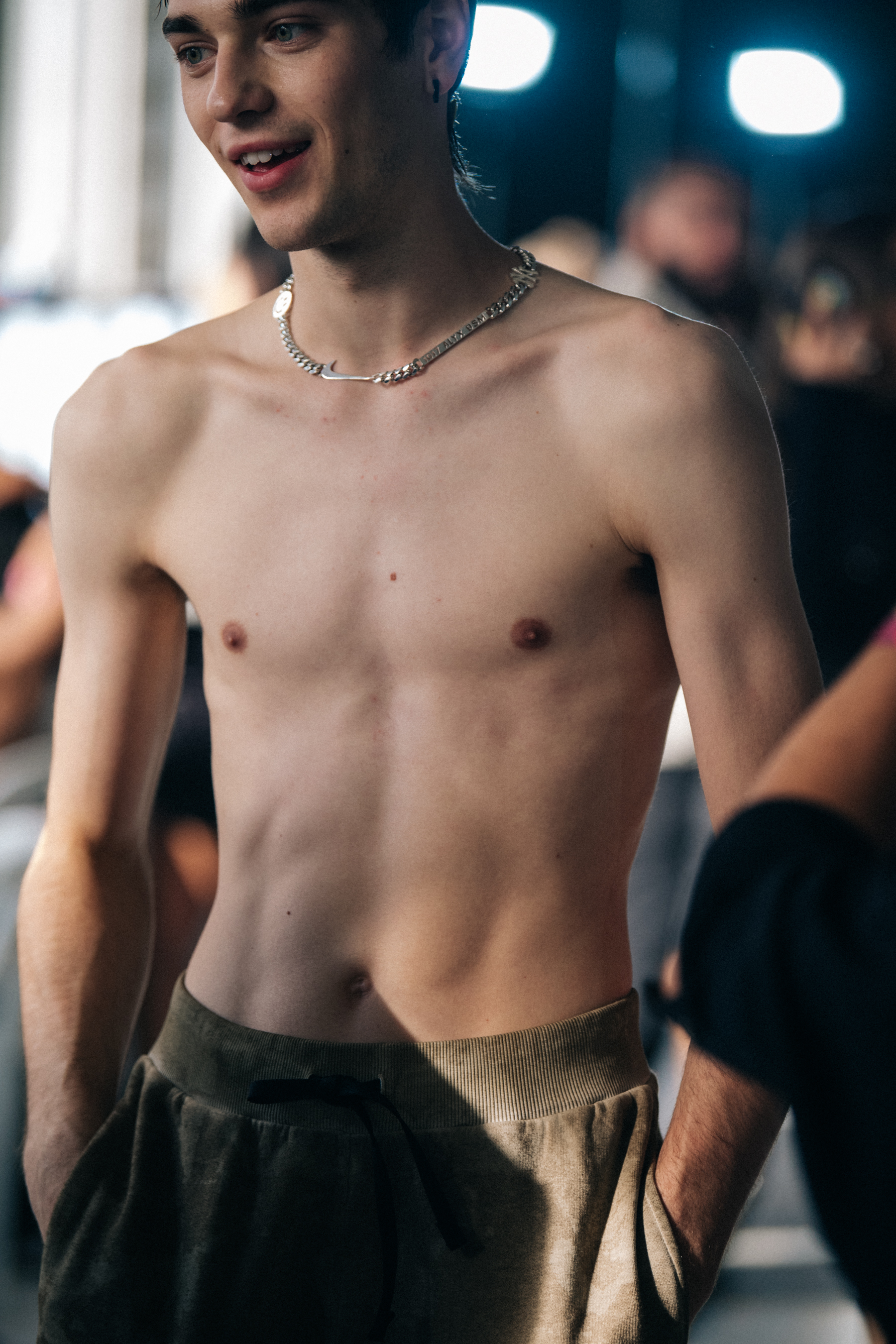 Topless model backstage at Alyx