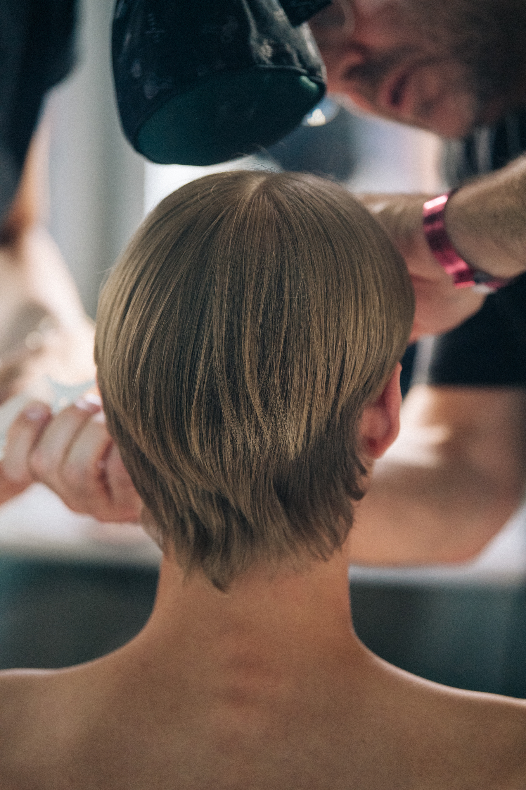 Model in hair and makeup backstage