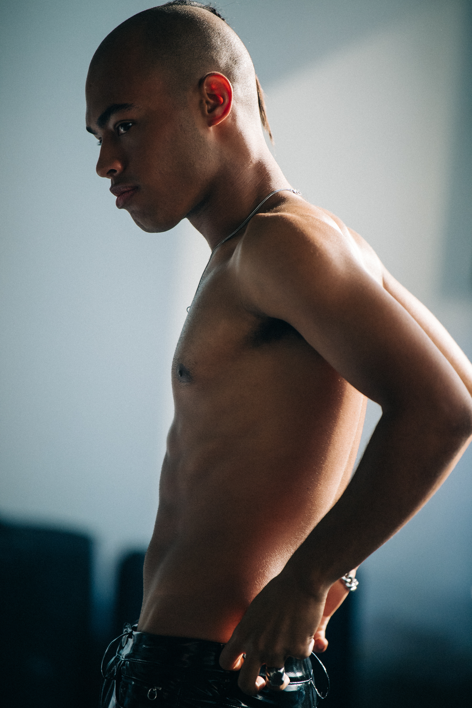 Topless model backstage at Alyx