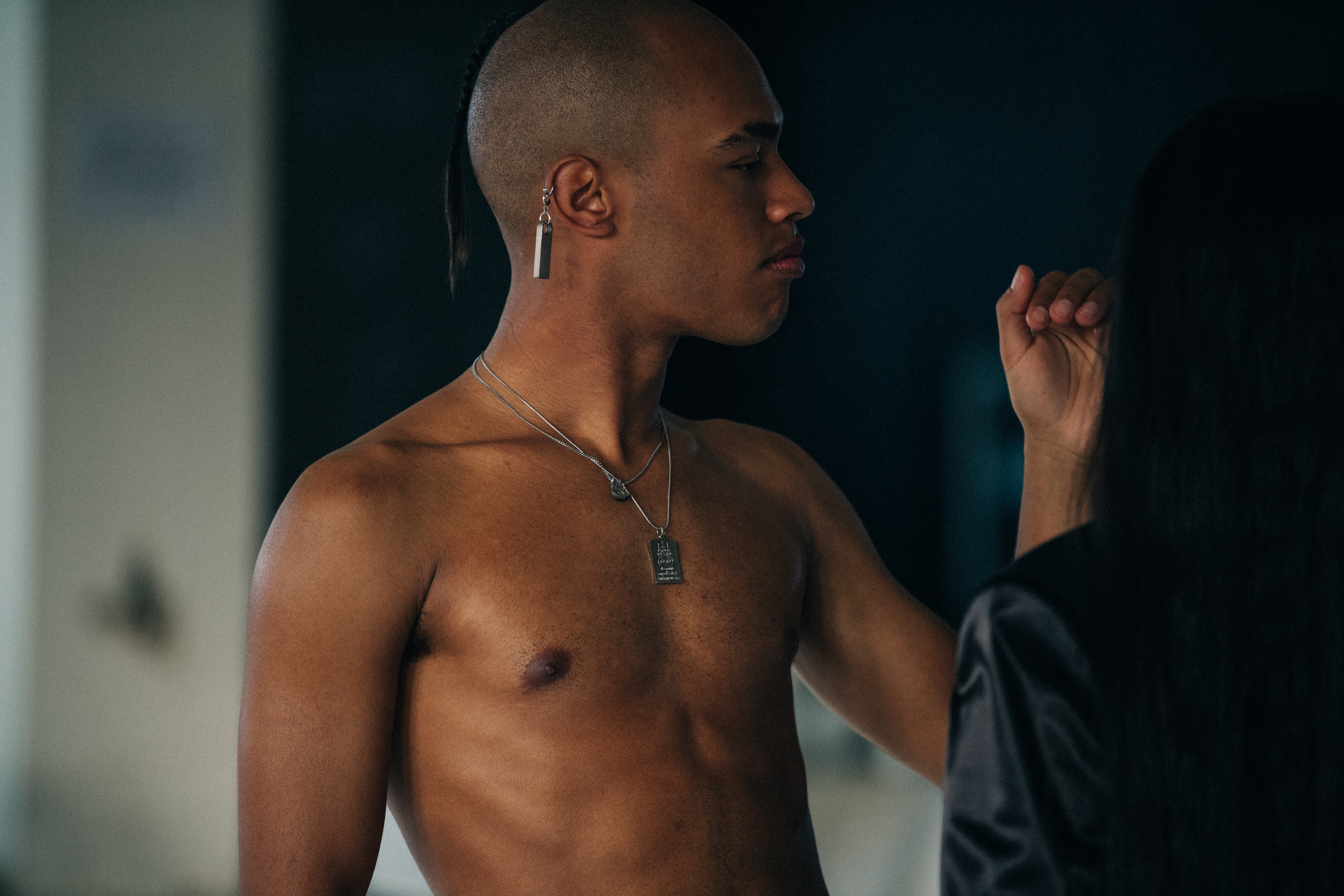 Topless model backstage at Alyx