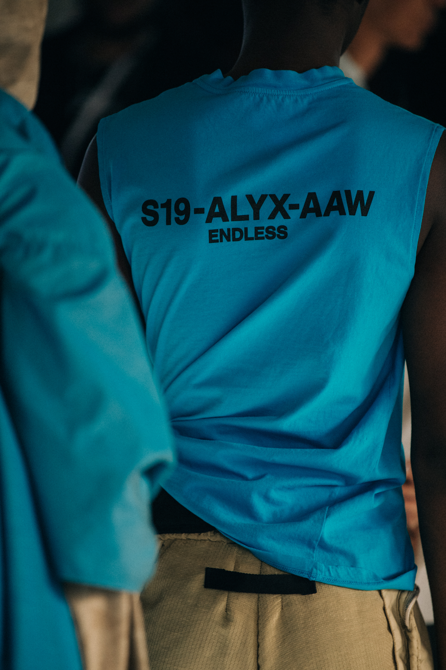Model wearing blue Alyx vest