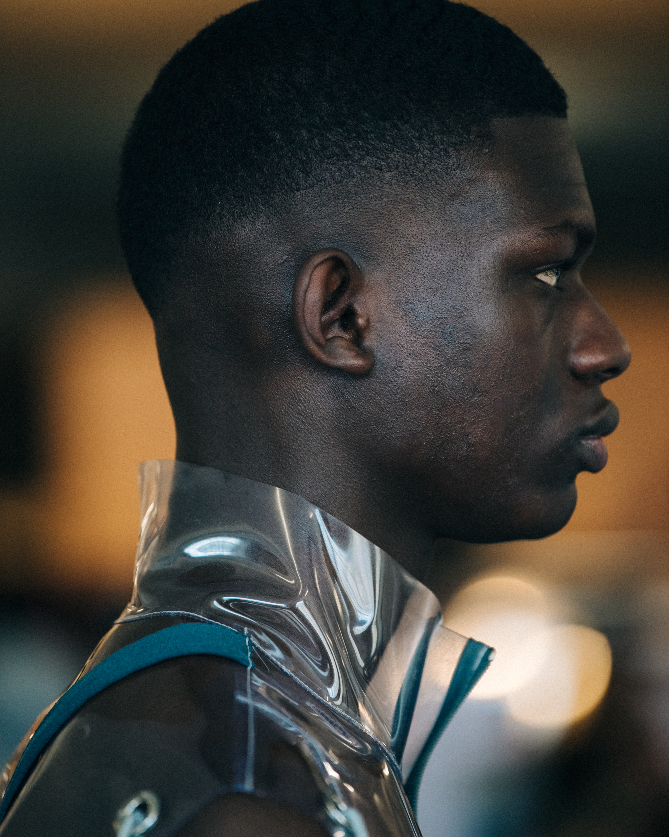 Model wearing plastic shirt