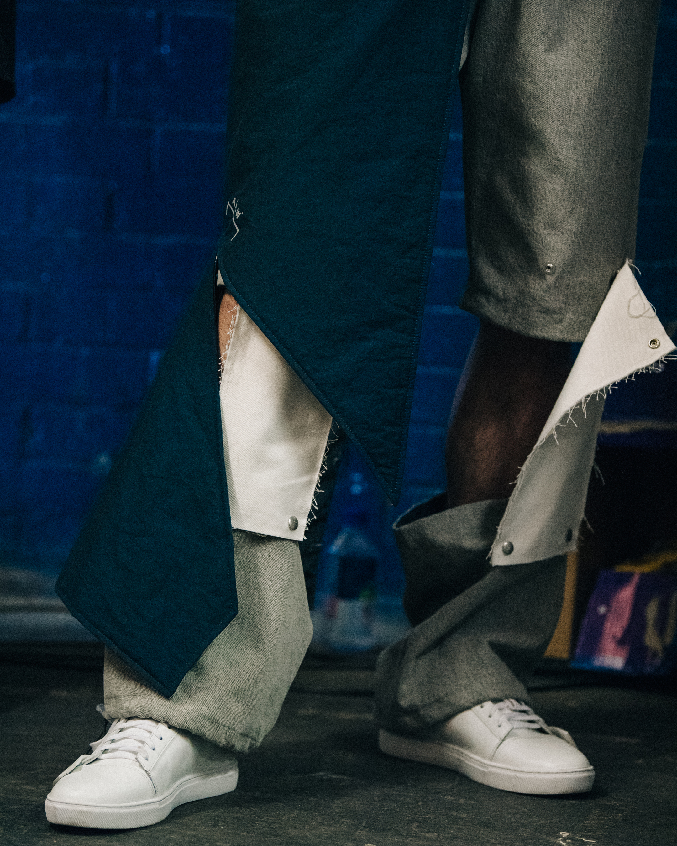Models wearing white sneakers backstage