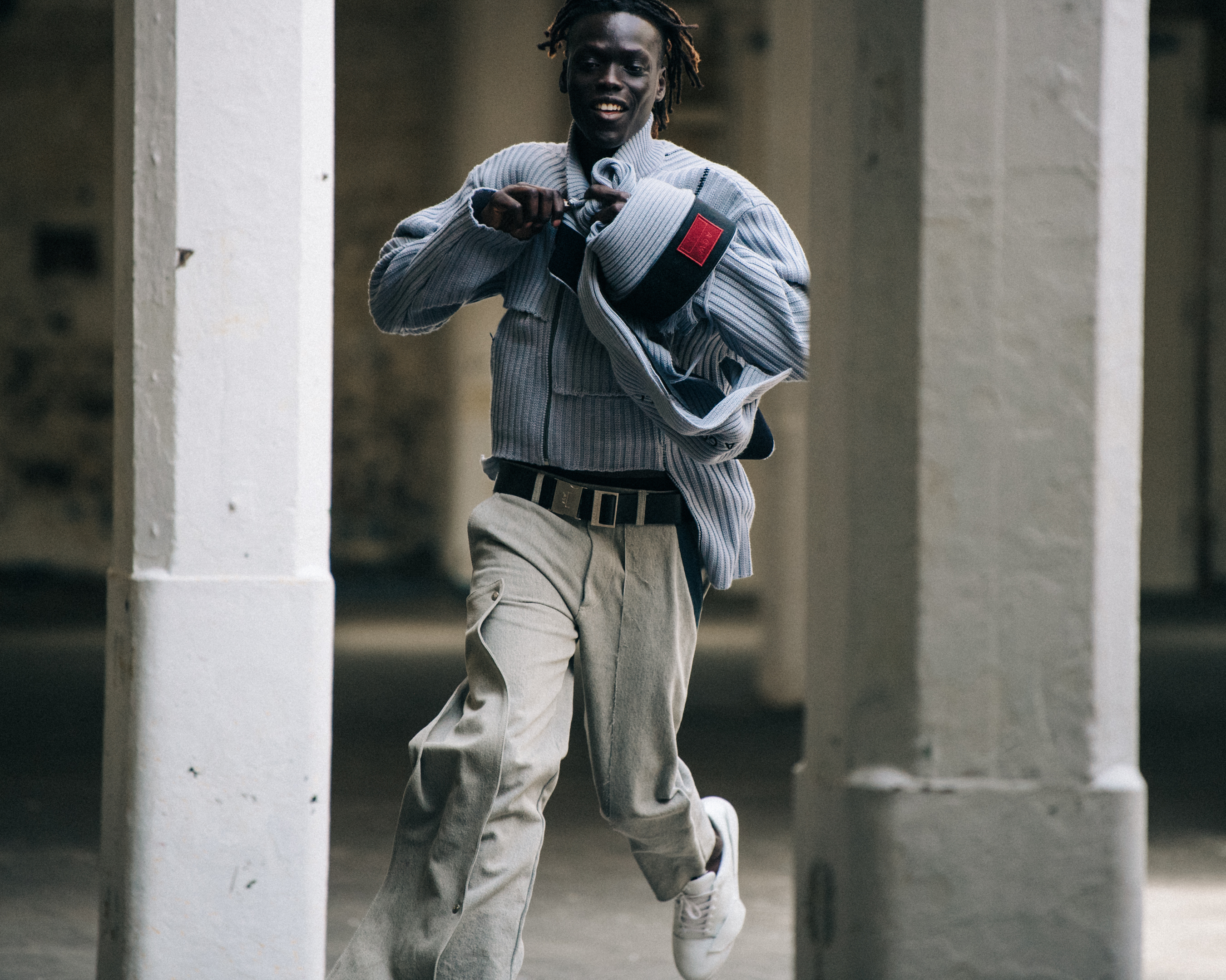Model wearing pale outfit