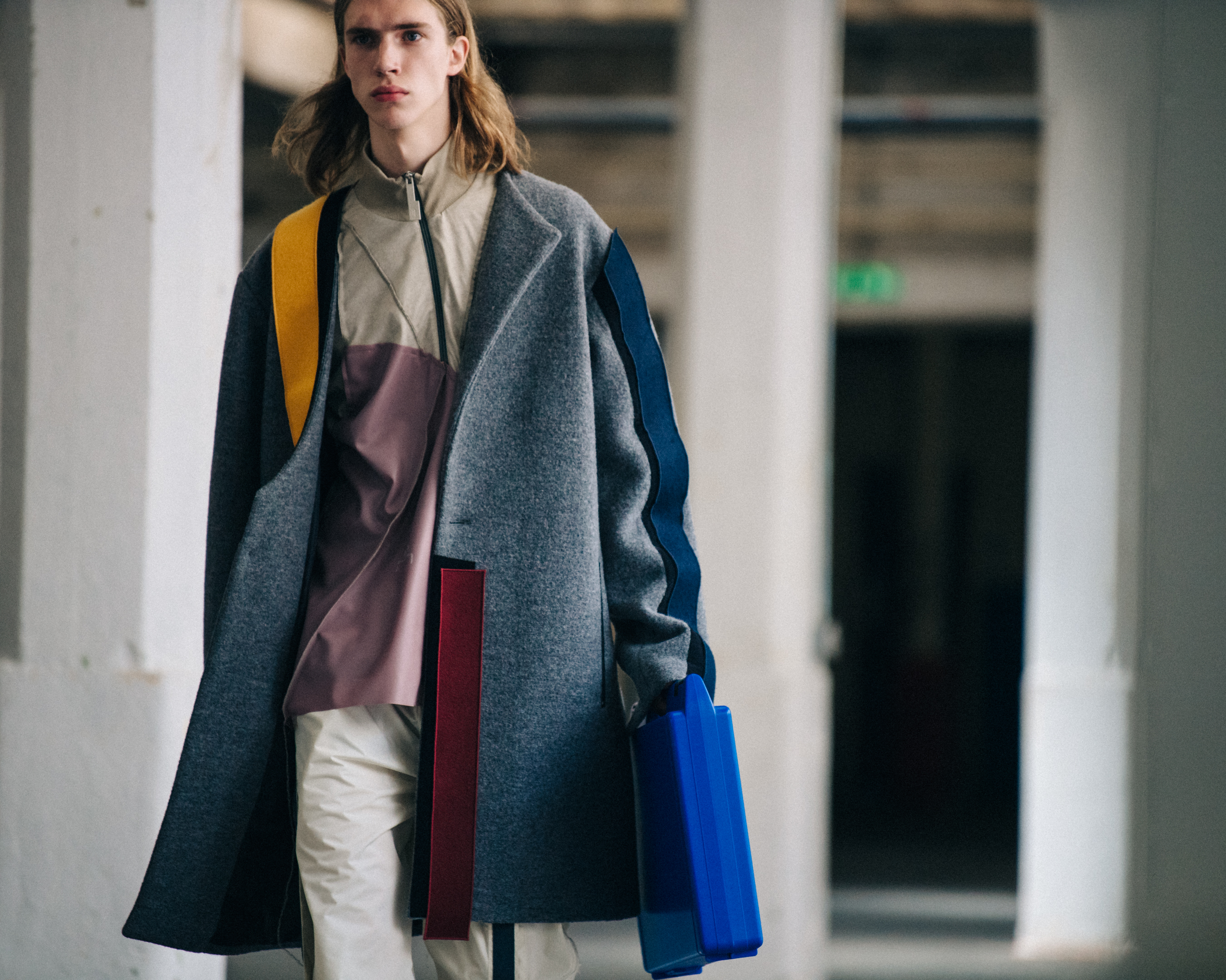 Model wearing grey coat at A-Cold-Wall*