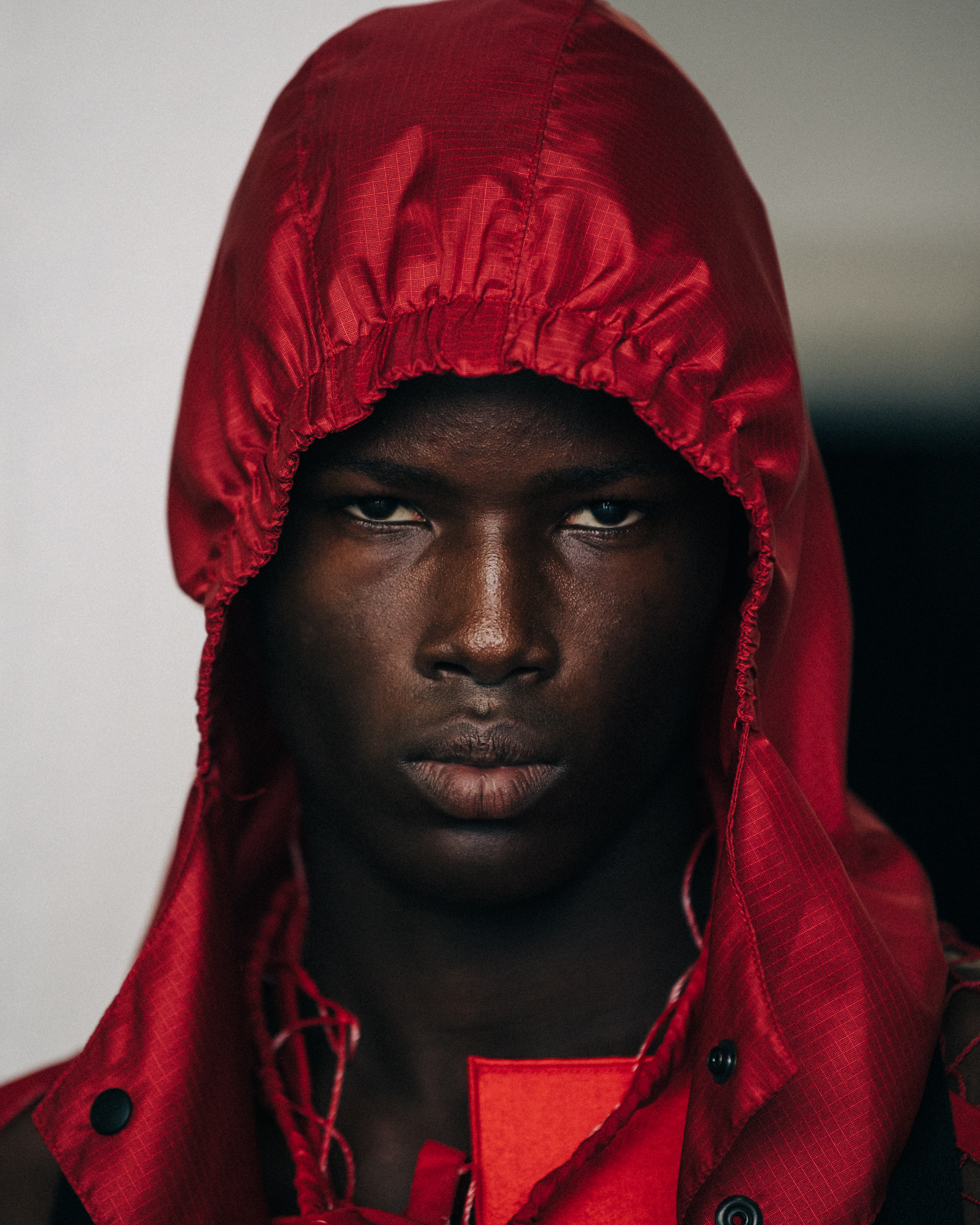 Portrait of model wearing red hood