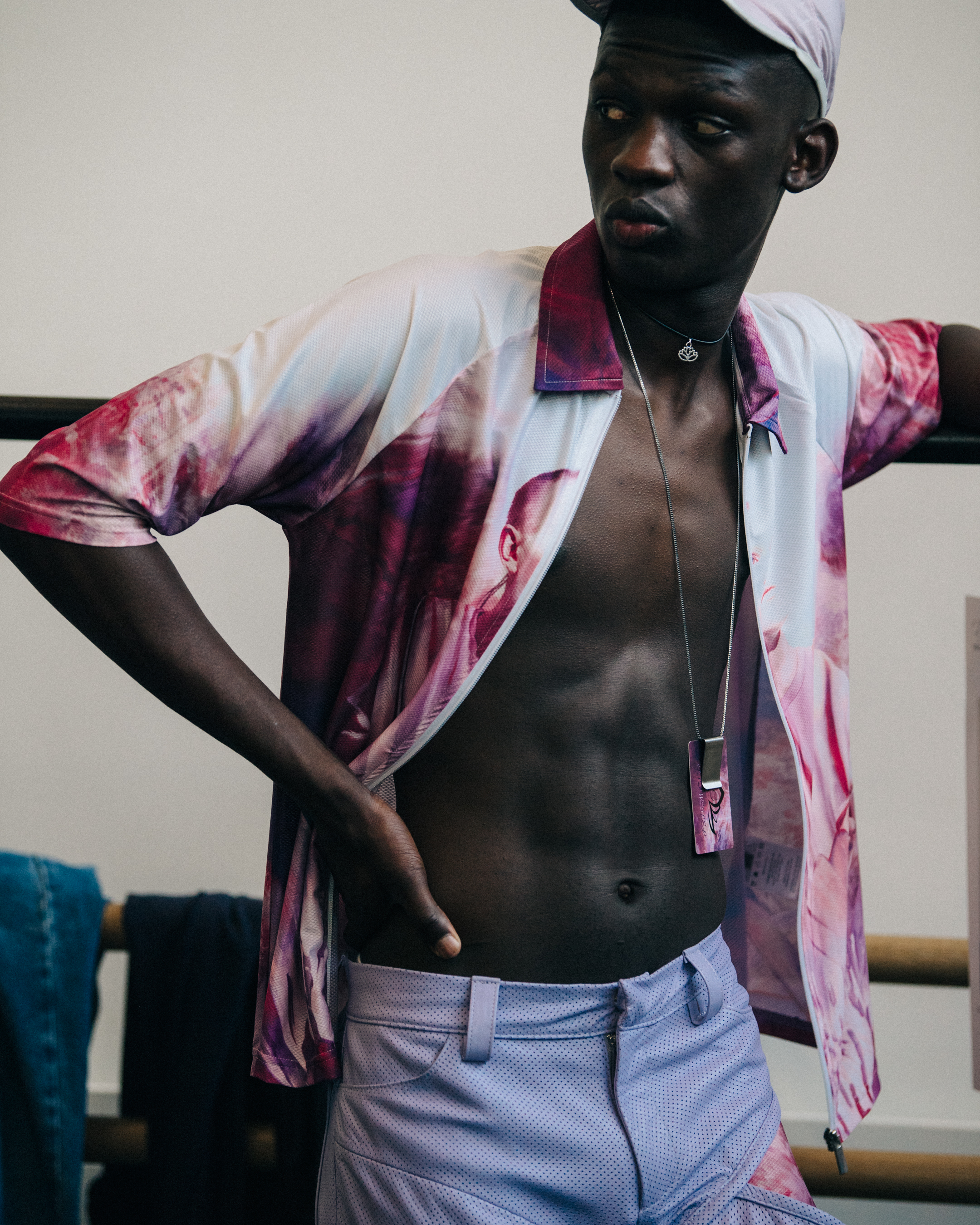 Model wearing purple zip top at Cottweiler