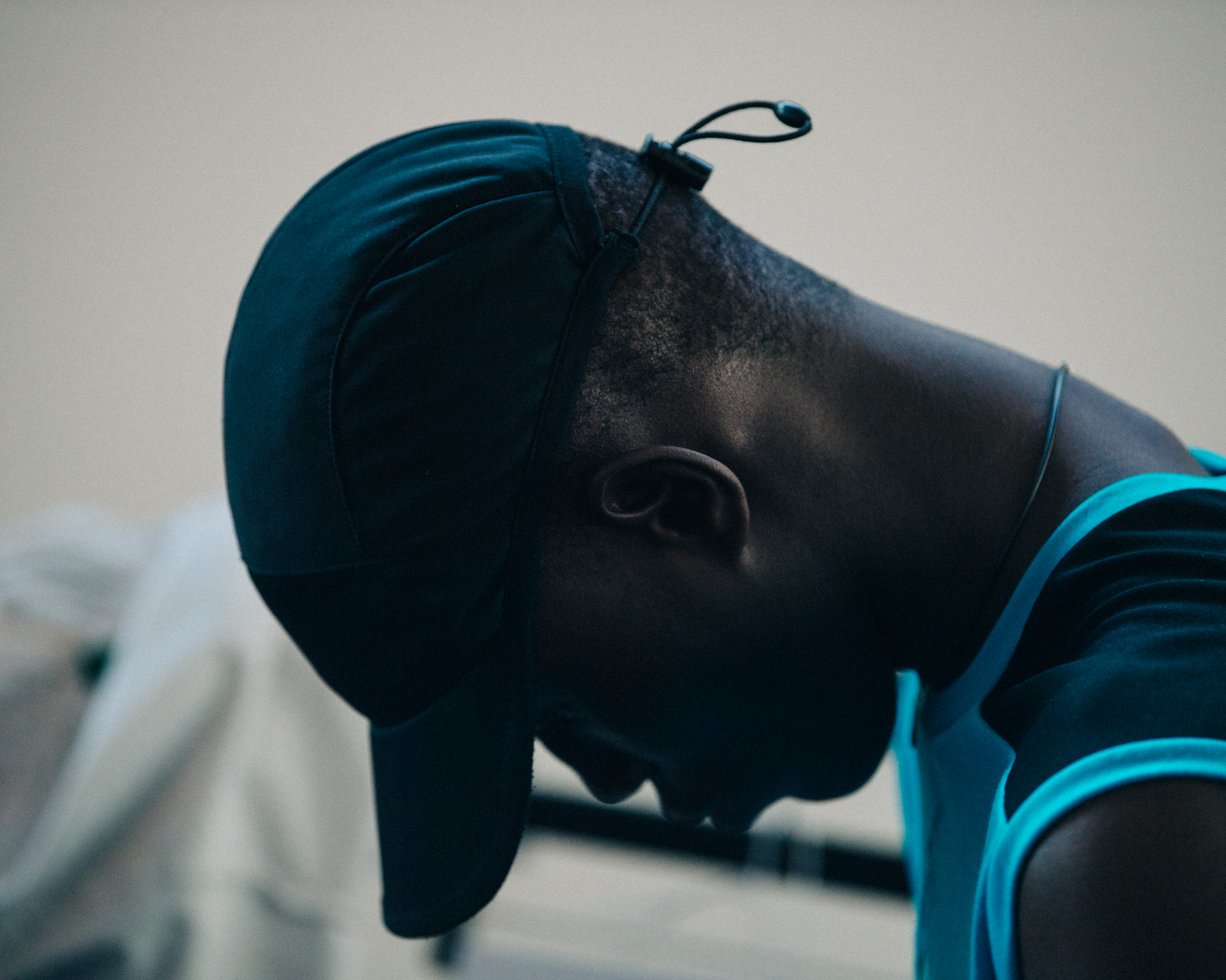 Model wearing black cap at Cottweiler