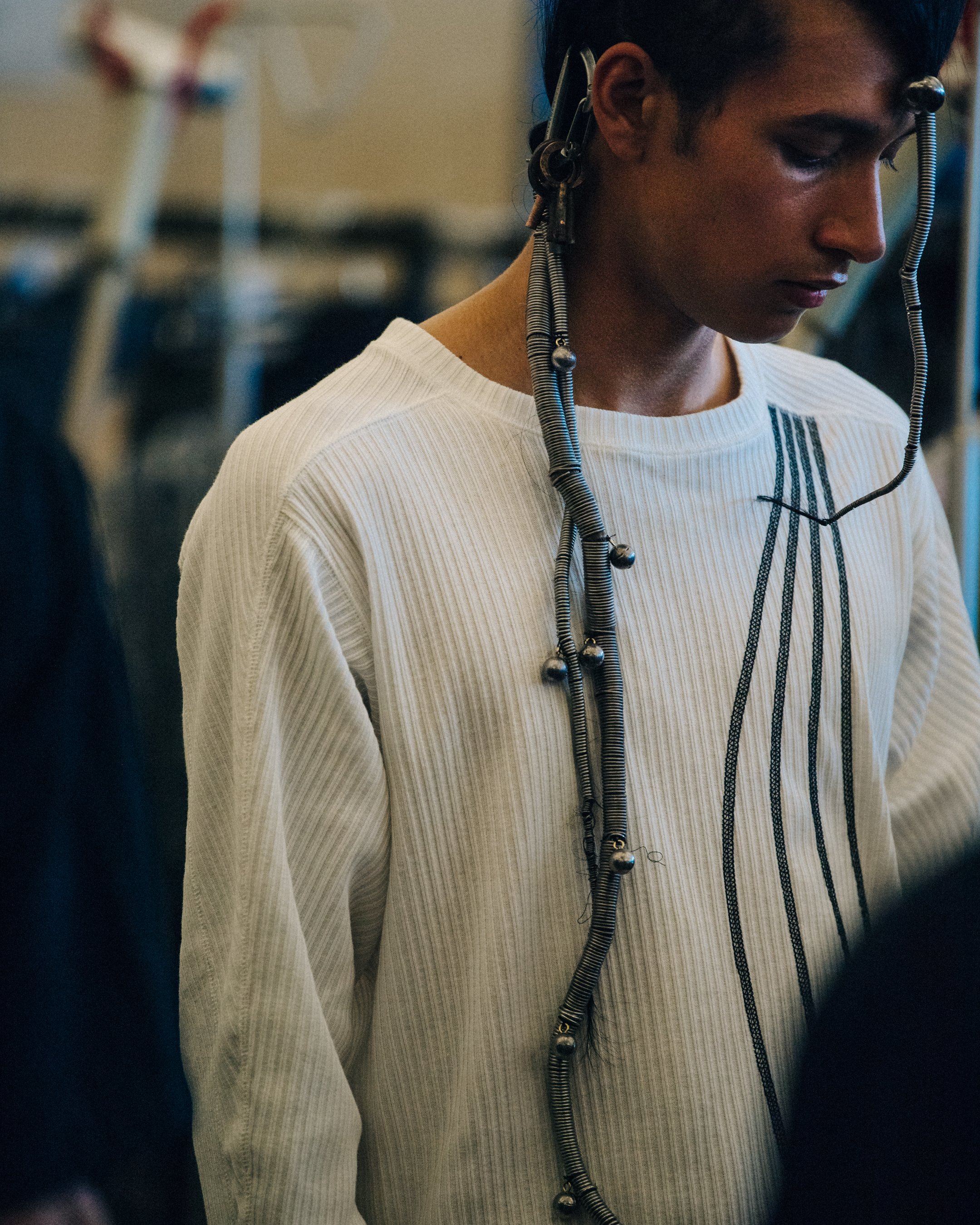 Model with long braided hair backstage