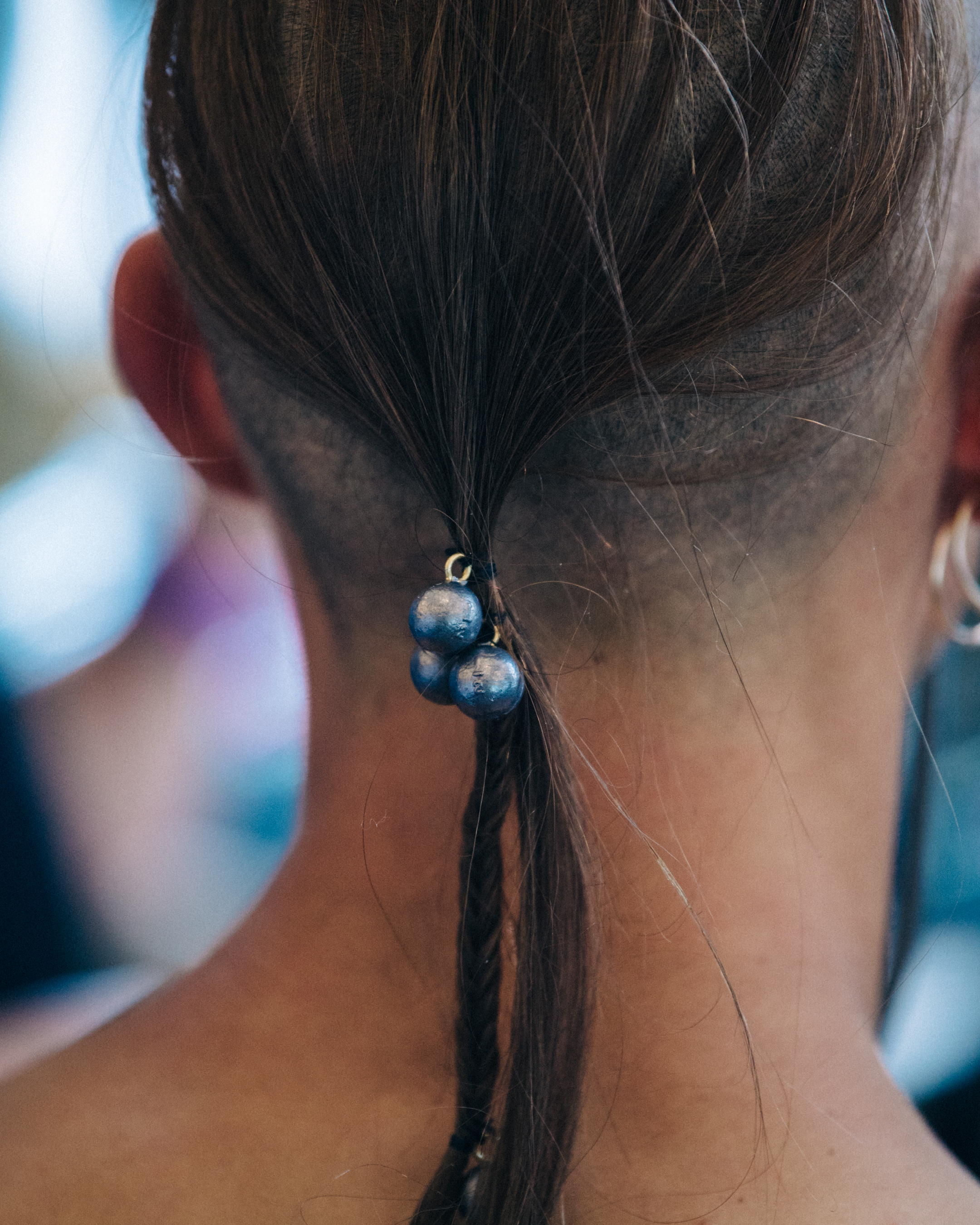 Model with long braided hair backstage