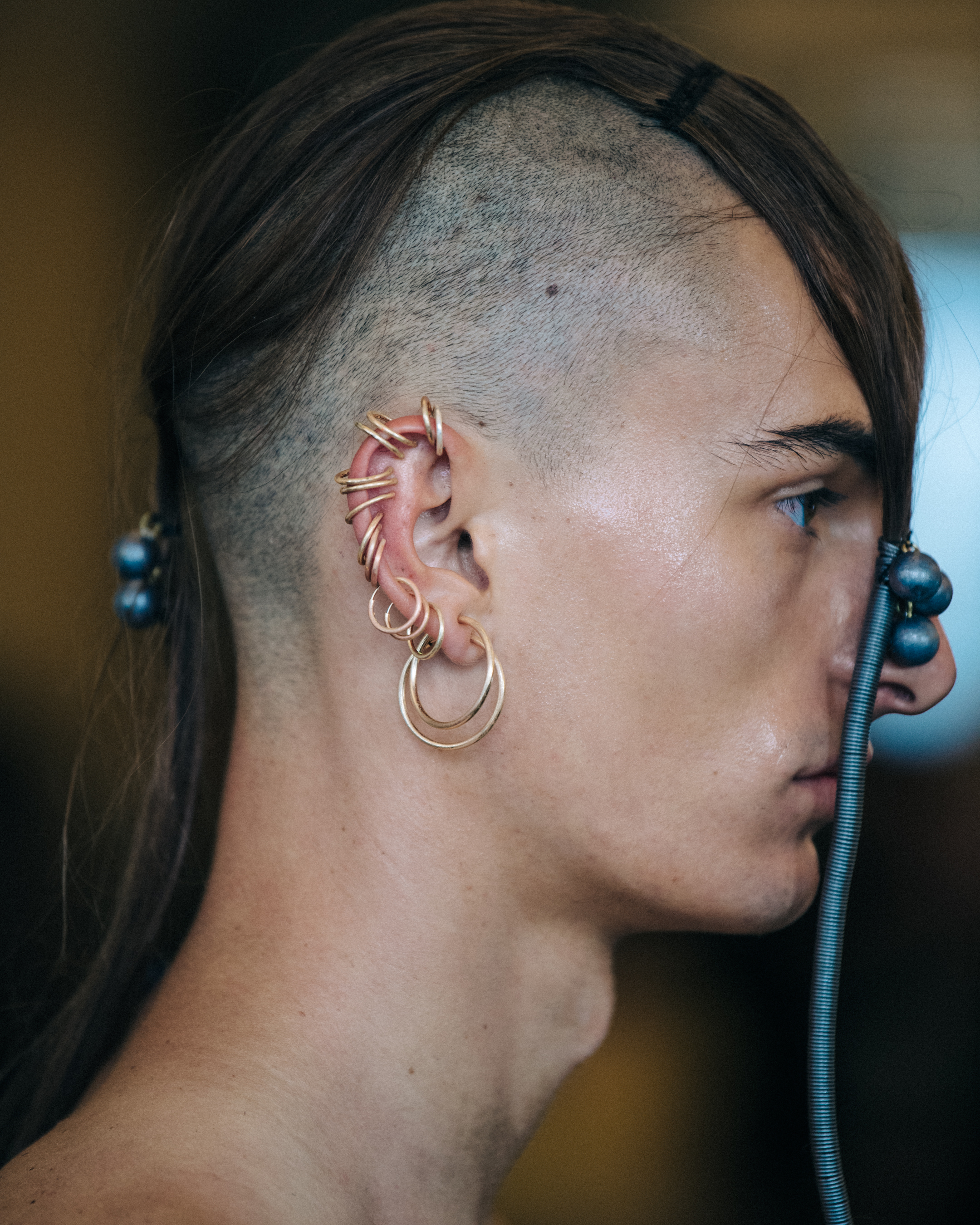 Model with long braided hair backstage
