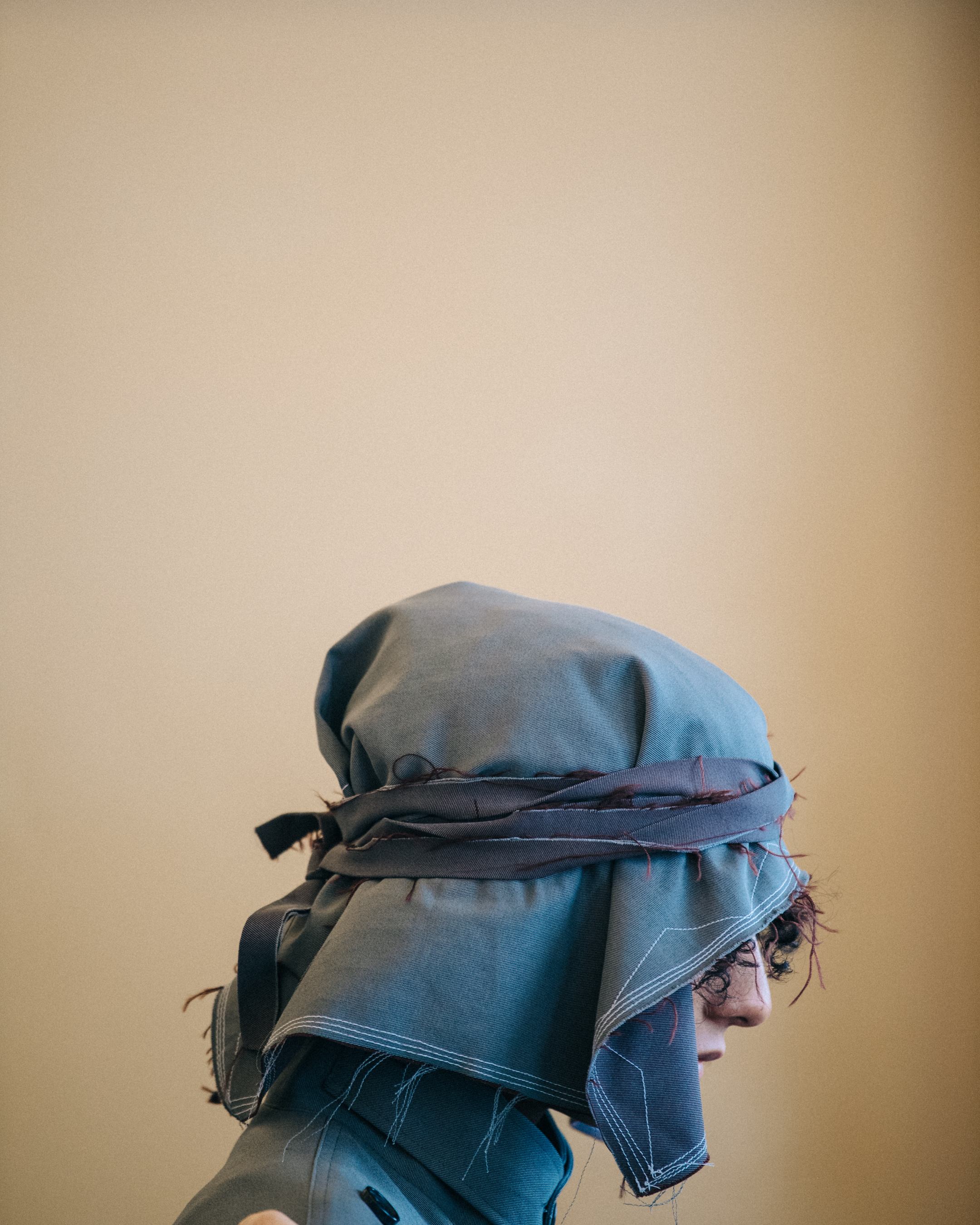 Models wearing hoods backstage